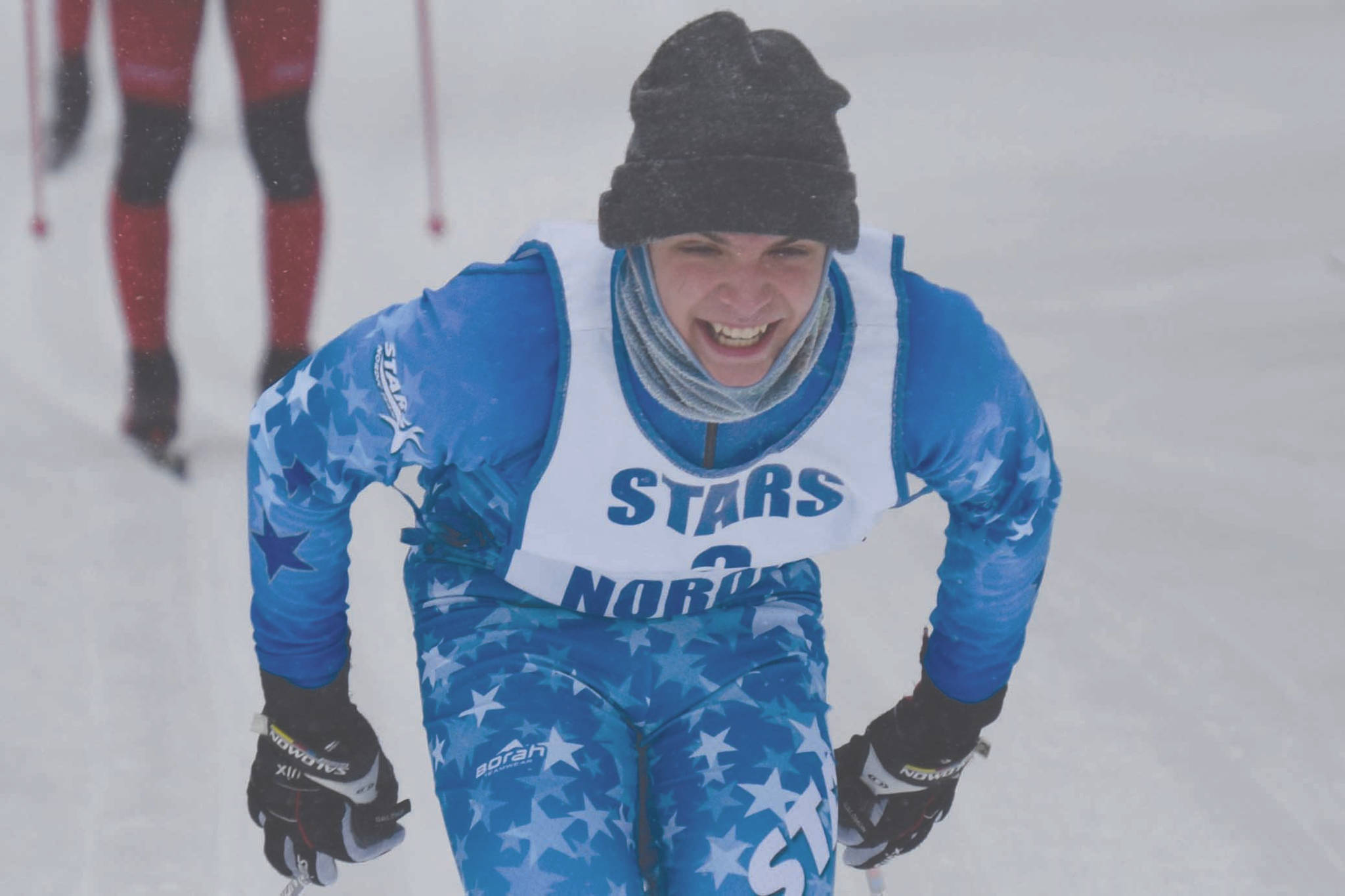 Soldotna's Quinn Cox poles ahead of Tyler Hippchen and Jack Laker on Saturday, Feb. 20, 2021, at the second day of the Kenai Peninsula Borough ski championships at Tsalteshi Trails just outside of Soldotna, Alaska. (Photo by Jeff Helminiak/Peninsula Clarion)