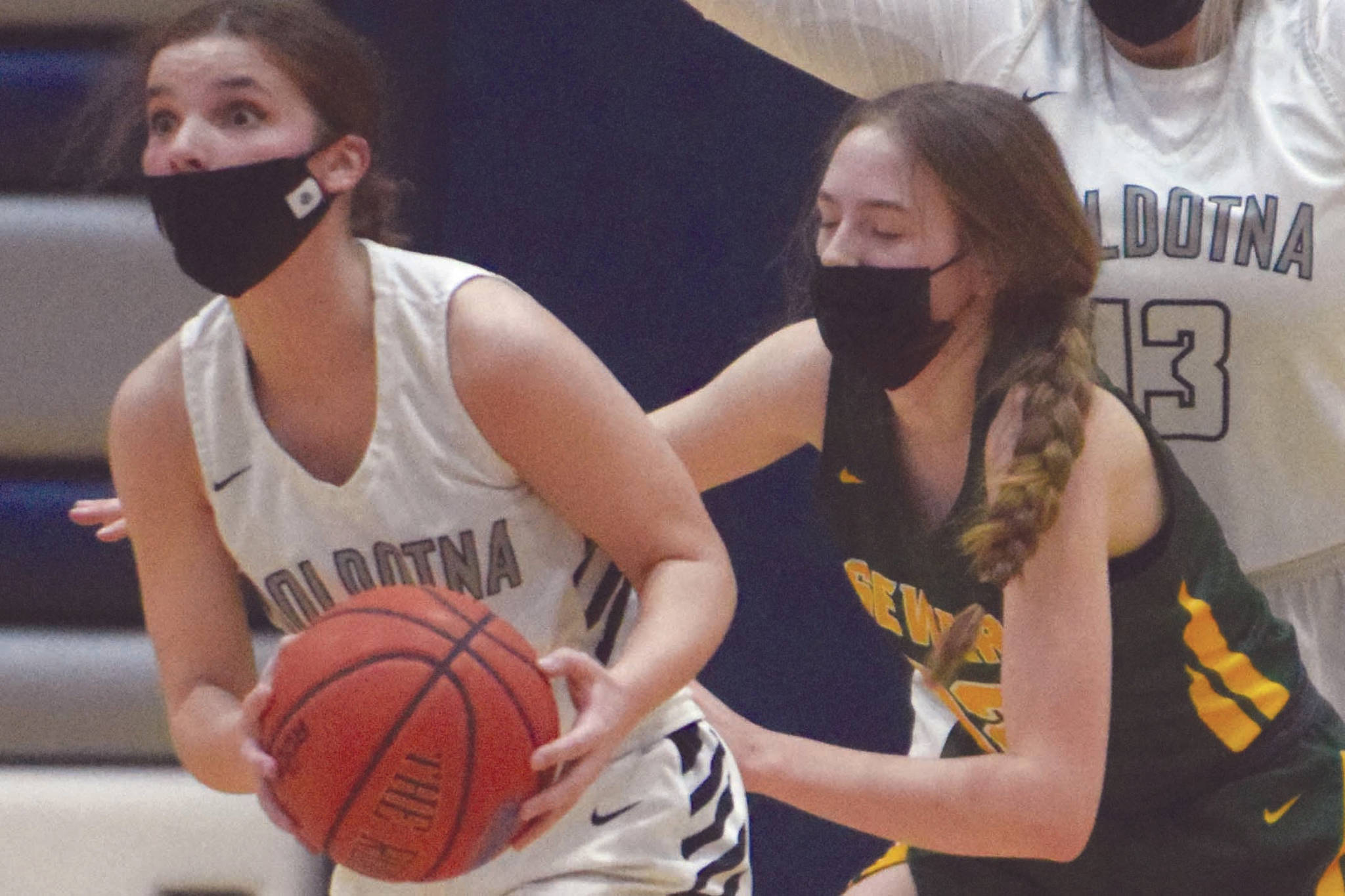 Soldotna's Morgan Bouschor looks for an outlet pass under pressure from Seward's Shelby Sieminski as Soldotna's Taylor Edwards looks on at Soldotna High School on Tuesday, Feb. 23, 2021, in Soldotna, Alaska. (Photo by Jeff Helminiak/Peninsula Clarion)