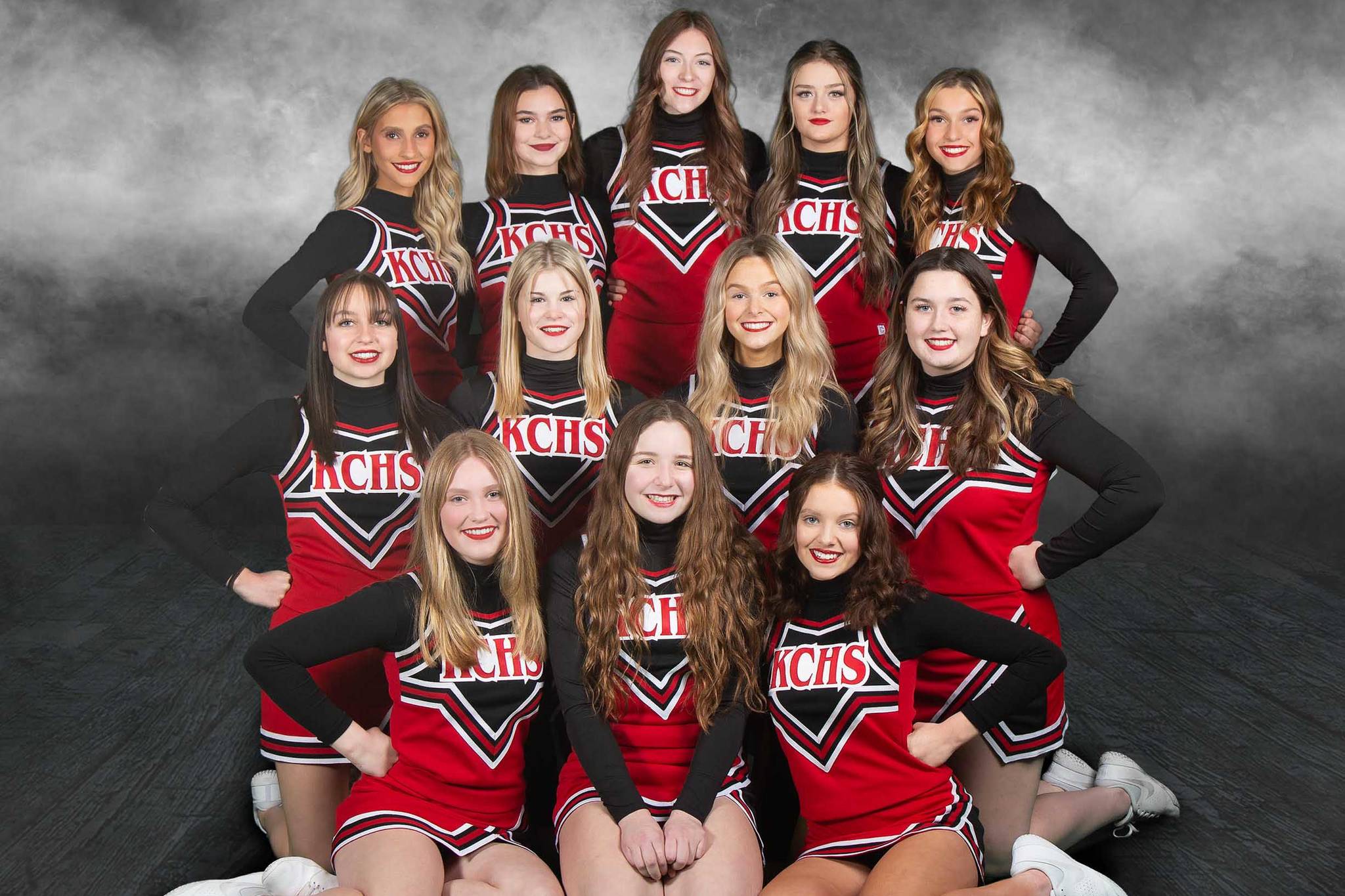 The Kenai Central high school cheerleading team. Back row, left to right: Karley Harden, Nia Calvert, Katie Stockton, Rileigh Pace and Kyrie Medina. Middle row: Karah Huff, Melena Grieme, Calani Holmes and Maya Montague. Front row: Emmalee Roney, Kaitlyn Taylor and Kori Moore. (Photo courtesy of Rebecca Beddow of BeKaptured Photography)