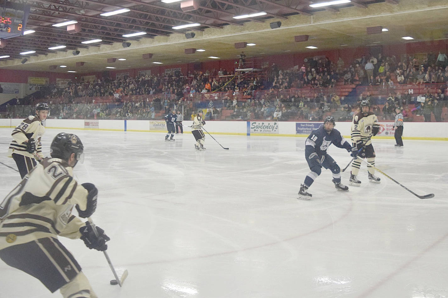 Kenai River Brown Bears defenseman Shayne Monahan controls the puck early in the third period as 1,113 fans watch Friday, March 24, 2017, at the Soldotna Regional Sports Complex. (Photo by Jeff Helminiak/Peninsula Clarion)