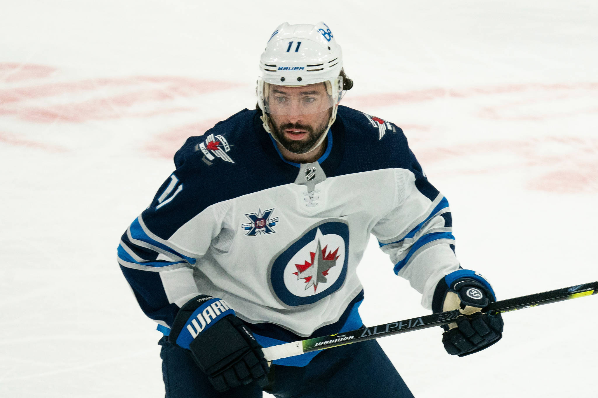 Winnipeg Jets center Nate Thompson (11) during an NHL hockey game against the Toronto Maple Leafs on Thursday, April 15, 2021, in Toronto, Canada. (AP Photo/Peter Power)