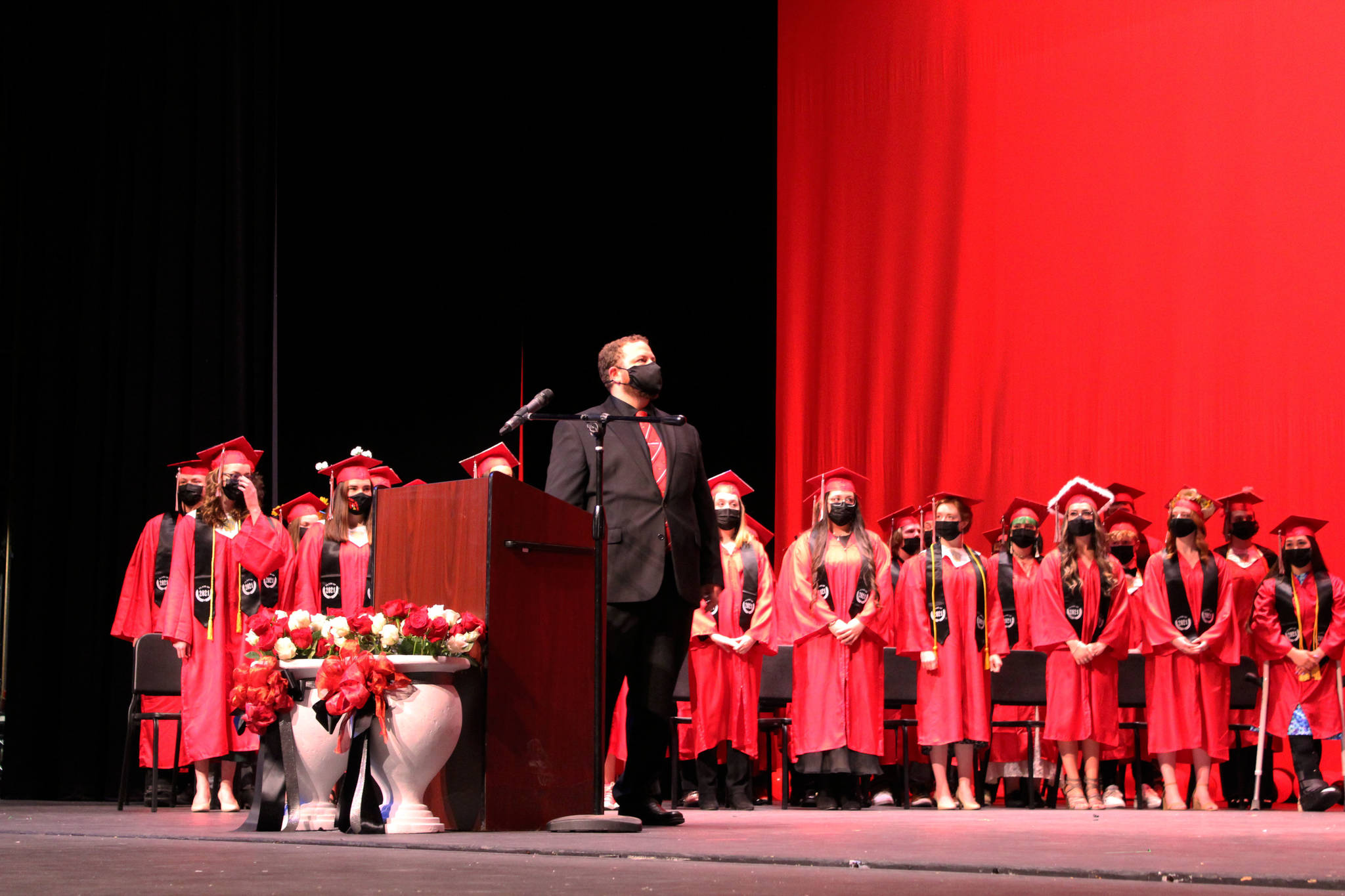 Kenai Central High School Assistant Principal Will Chervenak joins students on stage during graduation on Monday, May 17, 2021 in Kenai, Alaska. (Ashlyn O’Hara/Peninsula Clarion)