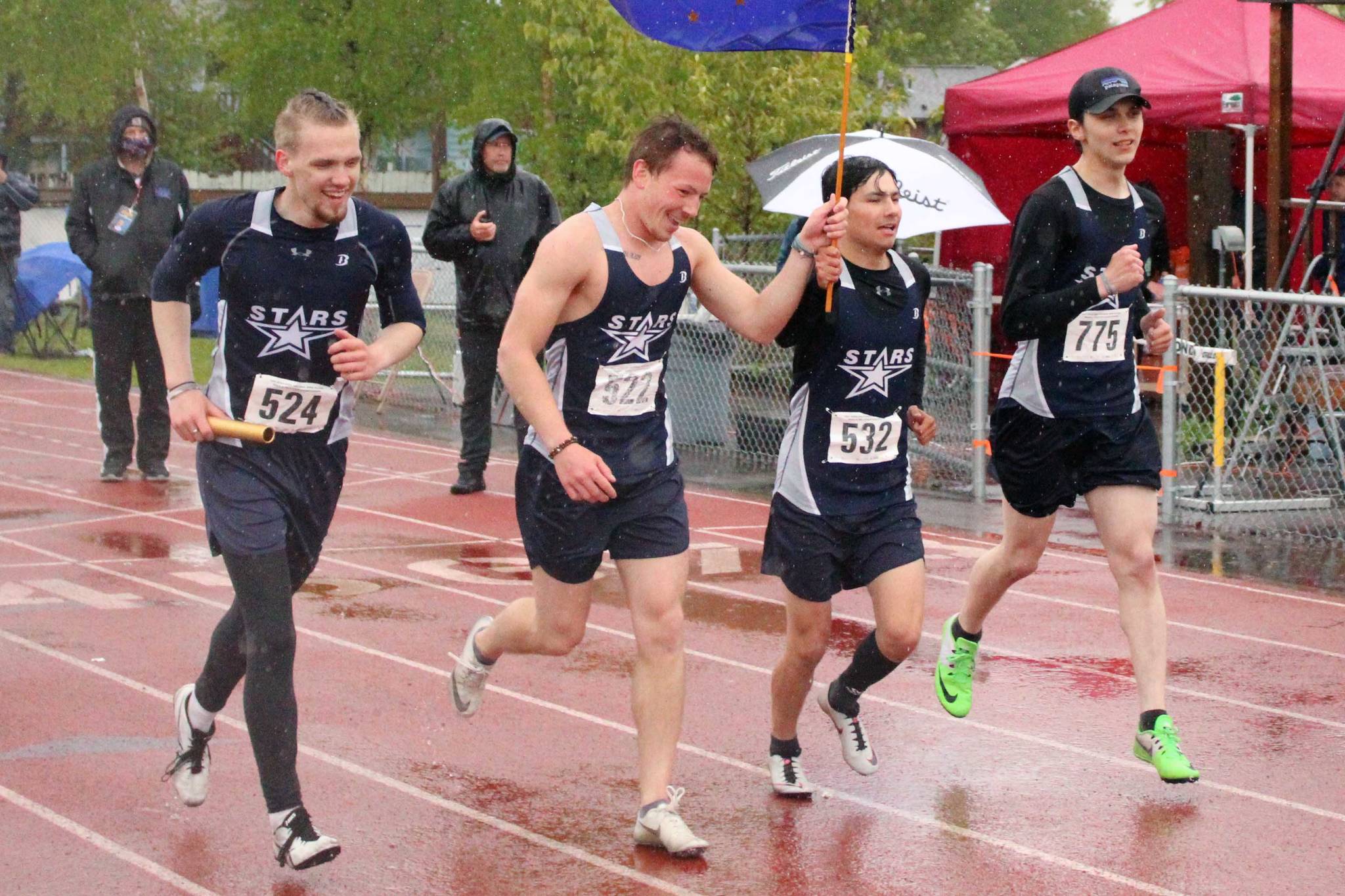 Soldotna's Eli Cravens, Zach Burns, Trenton O'Reagan and Avery Reid celebrate winning the 400-meter relay at the Division I state track and field meet at Dimond High School in Anchorage, Alaska, on Saturday, May 29, 2021. (Photo by Tim Rockey/Frontiersman)