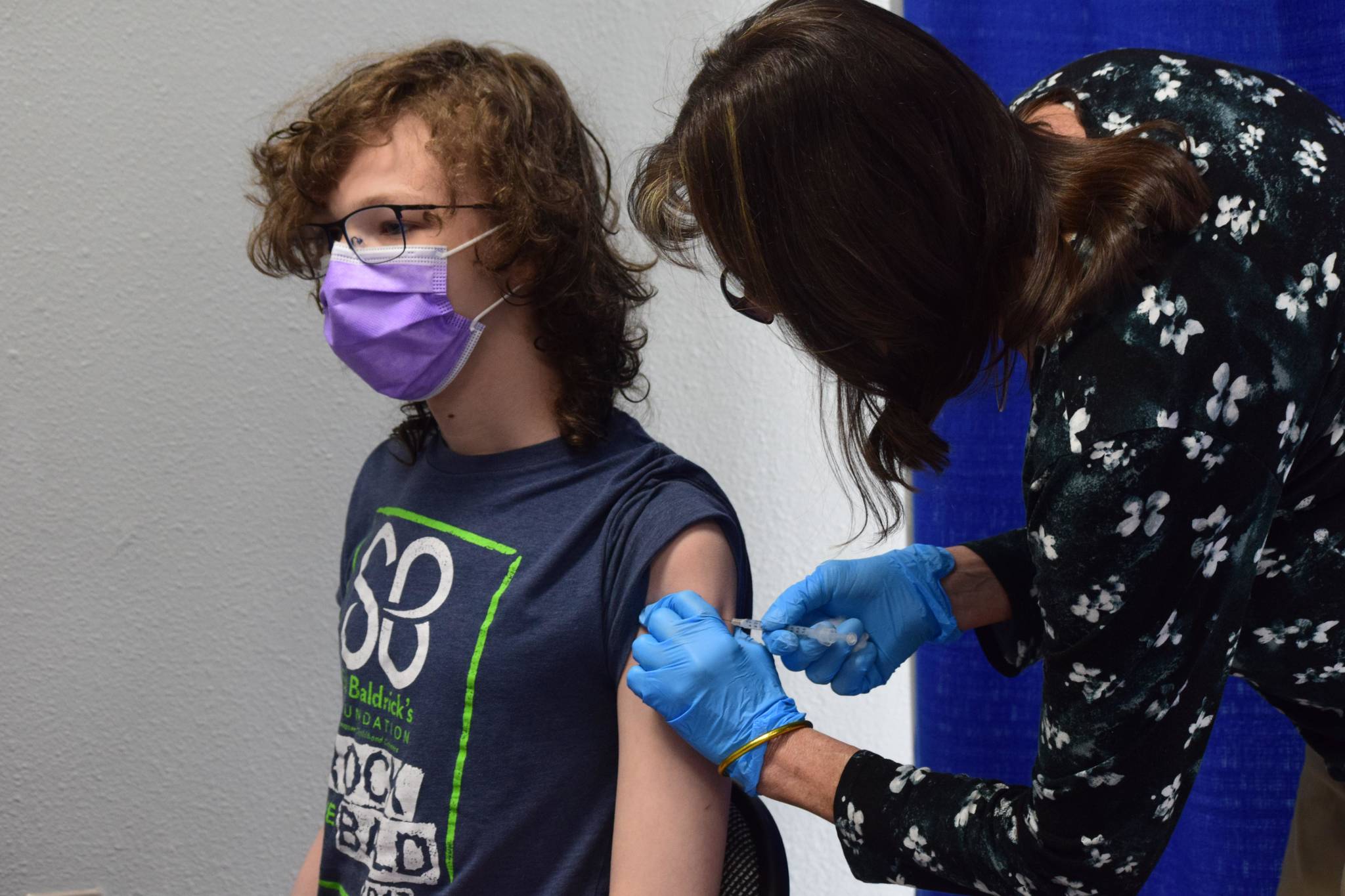 Gavin Hunt, 13, receives his second dose of the Pfizer-BioNTech vaccine at the walk-in clinic at the strip mall at the intersection of the Kenai Spur and Sterling Highways in Soldotna, Alaska, on Wednesday, June 9, 2021. (Camille Botello/Peninsula Clarion)