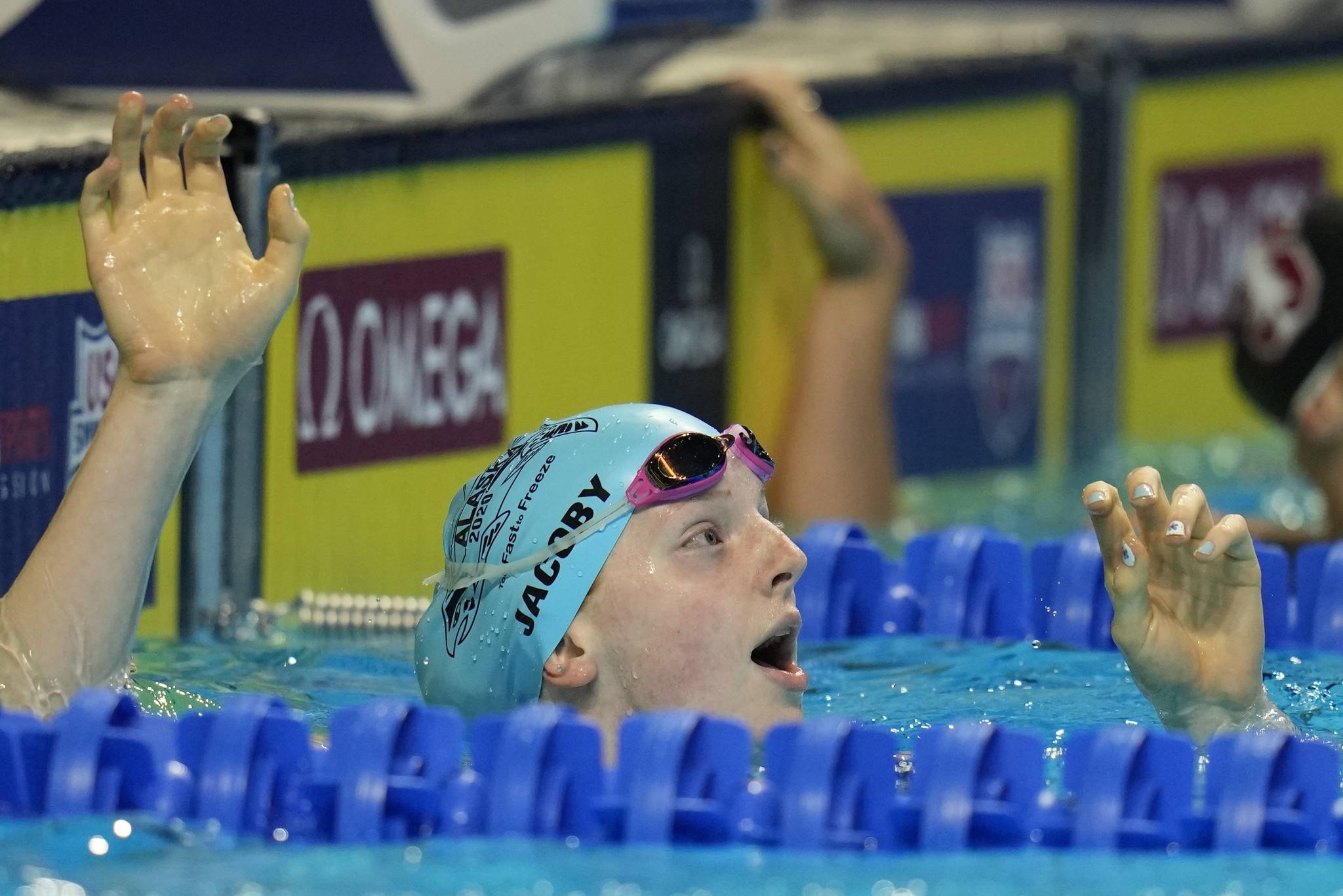 Lydia Jacoby reacts after winning her heat in the Women’s 100 Breaststroke during wave 2 of the U.S. Olympic Swim Trials on Monday, June 14, 2021, in Omaha, Neb. (AP Photo/Jeff Roberson)