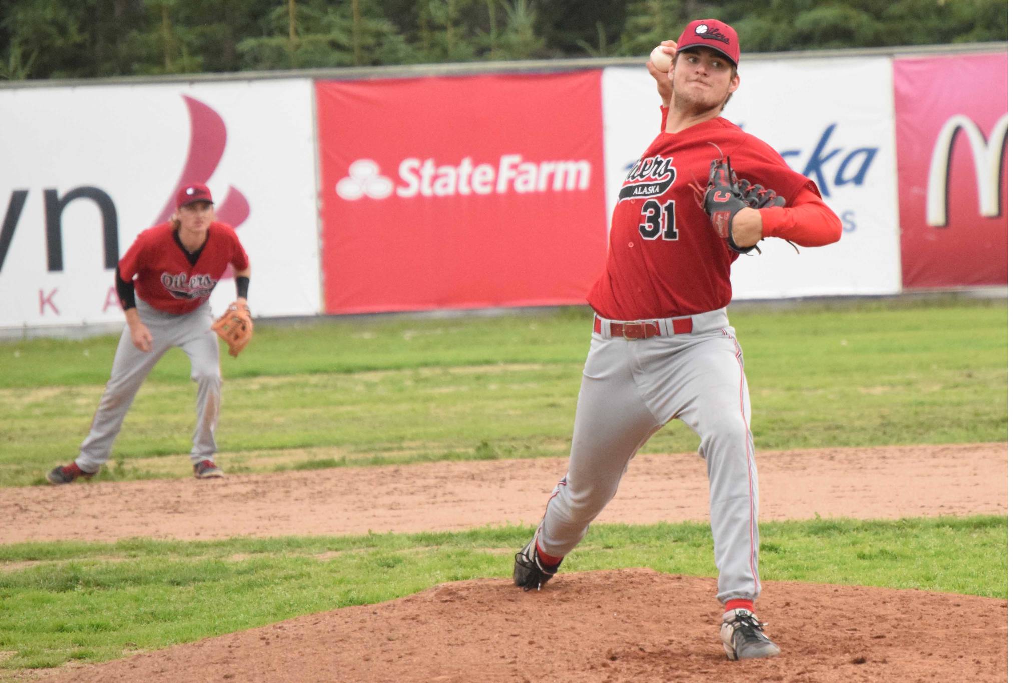 Oilers starting pitcher Luke Yacinich delivers to the Anchorage Glacier Pilots on Friday, July 23, 2021, at Coral Seymour Memorial Park in Kenai, Alaska. (Photo by Jeff Helminiak/Peninsula Clarion)