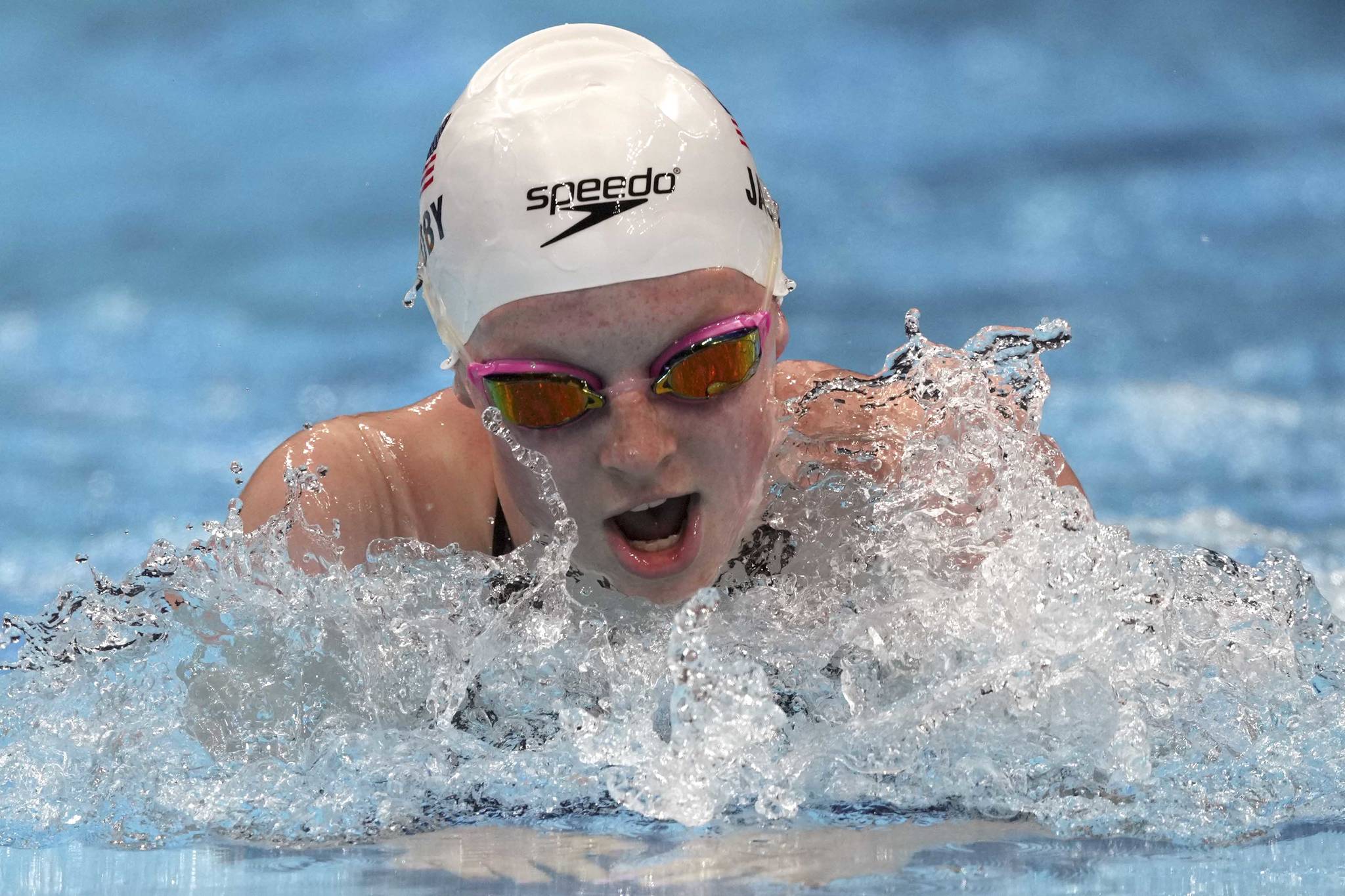 Lydia Jacoby of the United States swims in a heat during the women's 100-meter breaststroke at the 2020 Summer Olympics, Sunday, July 25, 2021, in Tokyo, Japan. (AP Photo/Matthias Schrader)