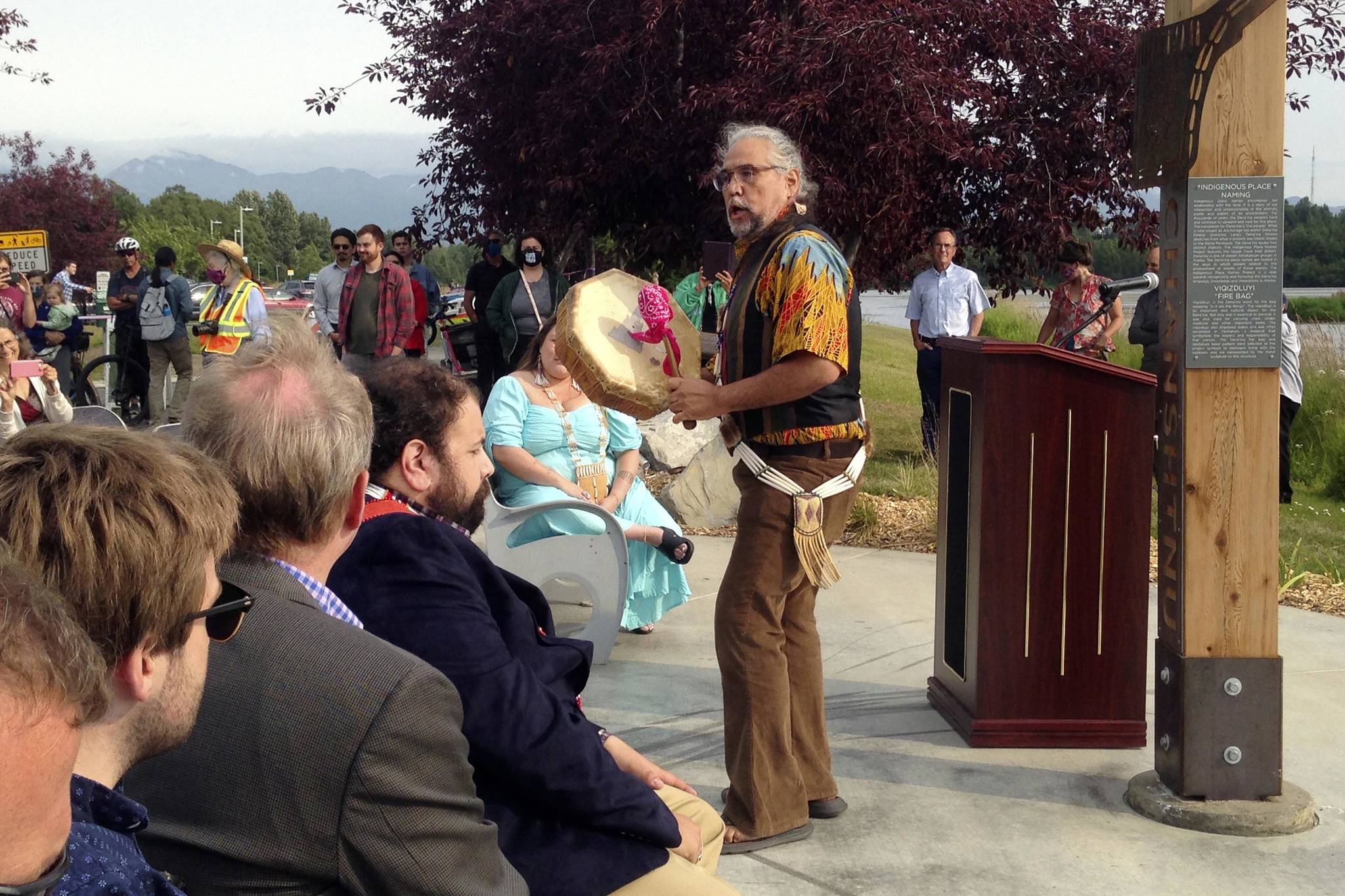 Athabascan singer and storyteller George Holly, performs at the unveiling of a place-name marker at Chanshtnu, or “grassy creek,” the Dena’ina Athabascan name for Westchester Lagoon, on Tuesday, Aug. 3, 2021, in Anchorage, Alaska. (Joaqlin Estus/Indian Country Today via AP