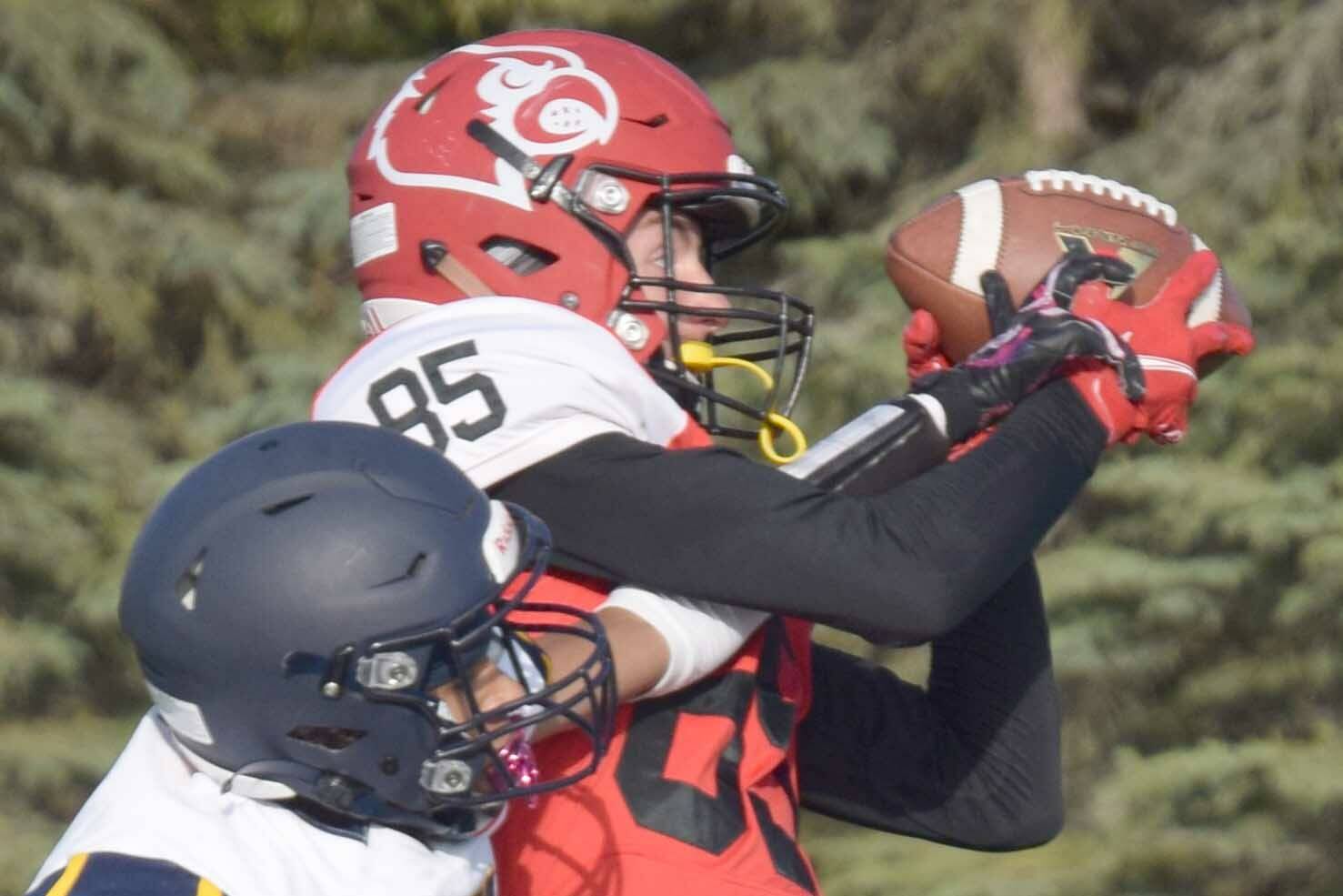 Kenai Central's David Martin catches a touchdown on Homer's Morgen Techie on Friday, Sept. 17, 2021, at Ed Hollier Field in Kenai, Alaska. (Photo by Jeff Helminiak/Peninsula Clarion)