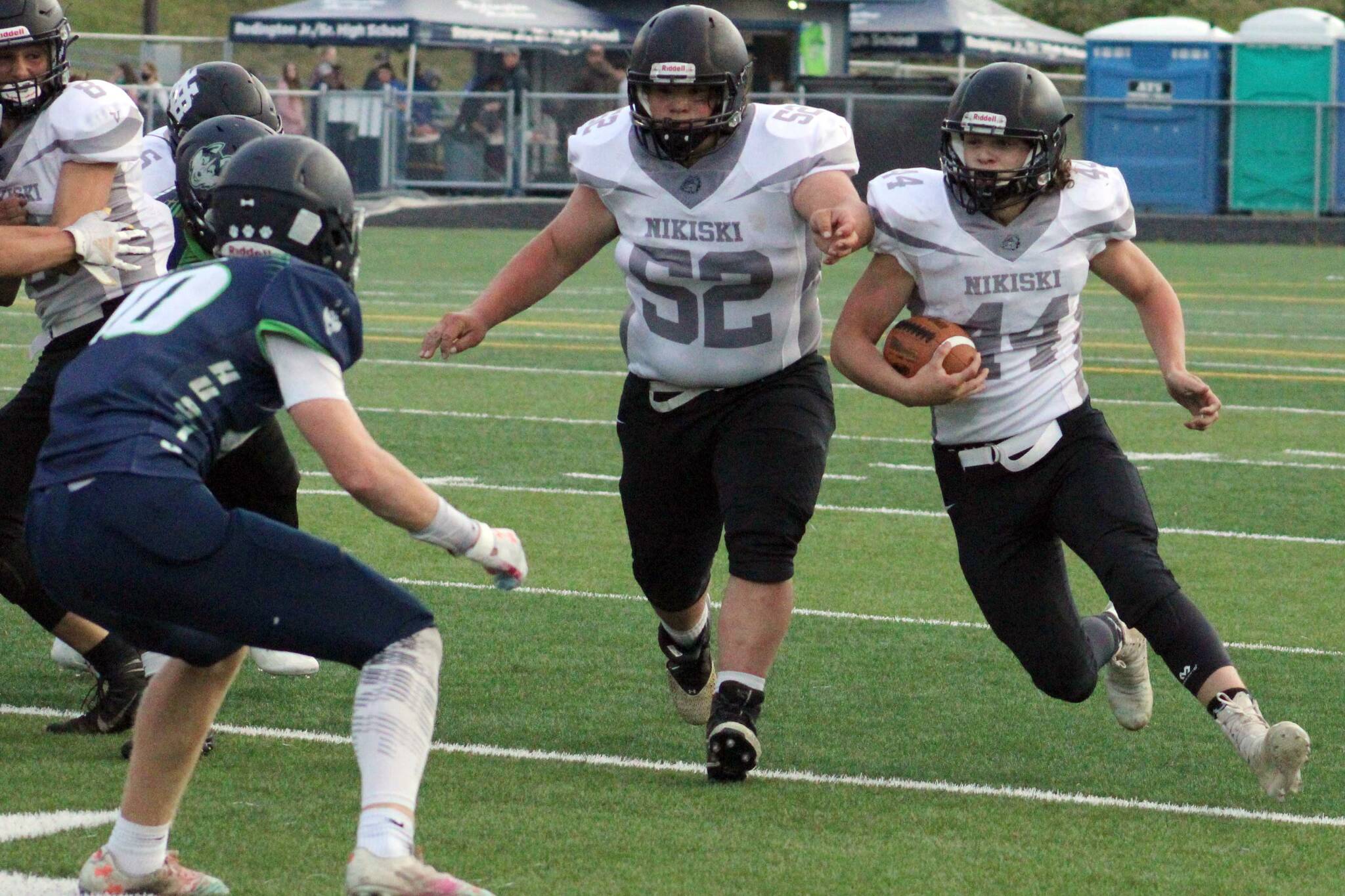 Nikiski's Mayaac Schmit blocks for Truit McCaughey on Friday, Sept. 17, 2021, at Redington High School in Alaska. (Photo by Tim Rockey/Frontiersman)