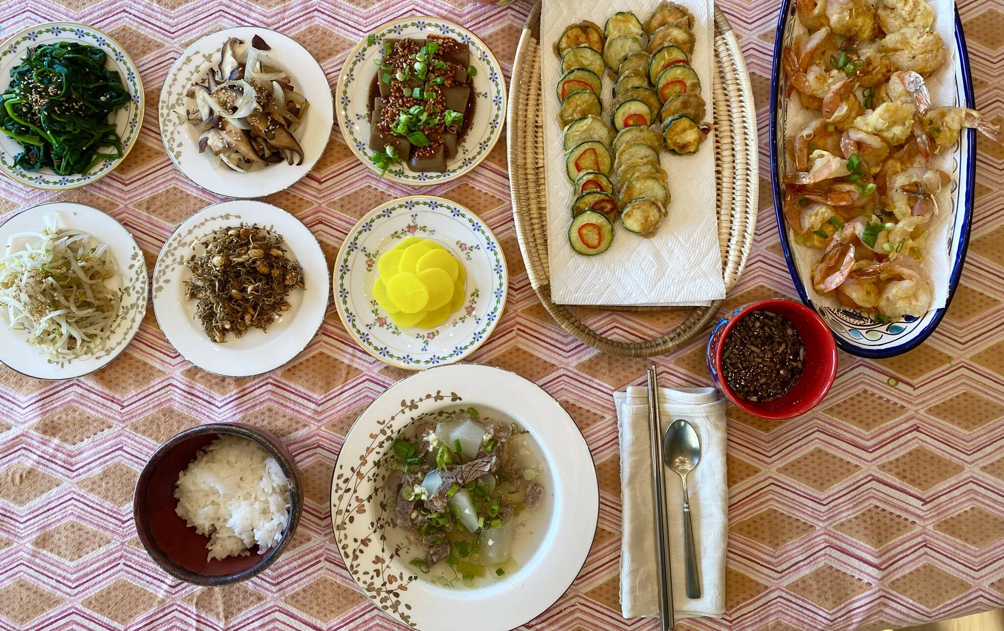 Seasoned spinach, sauteed mushrooms and onion, acorn jelly, seasoned mung bean sprouts, stir-fried dried anchovies and peanuts, pickled radish, fried zucchini, fried shrimp pancakes, and beef and radish soup were featured in the author’s celebration of Chuseok. The traditional Korean harvest festival dates to antiquity and pays homage to Korea’s ancient farming roots and was celebrated Tuesday, Sept. 21, 2021. (Photo by Tressa Dale/Peninsula Clarion)