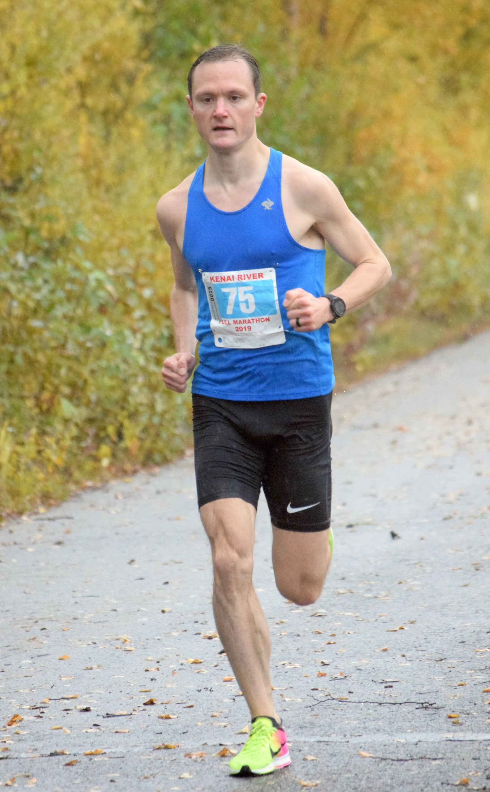 Kenai's Jason Parks, running on Kalifornsky Beach Road in Kenai, Alaska, wins the Kenai River Marathon on Sept. 28, 2019. (Photo by Jeff Helminiak/Peninsula Clarion)