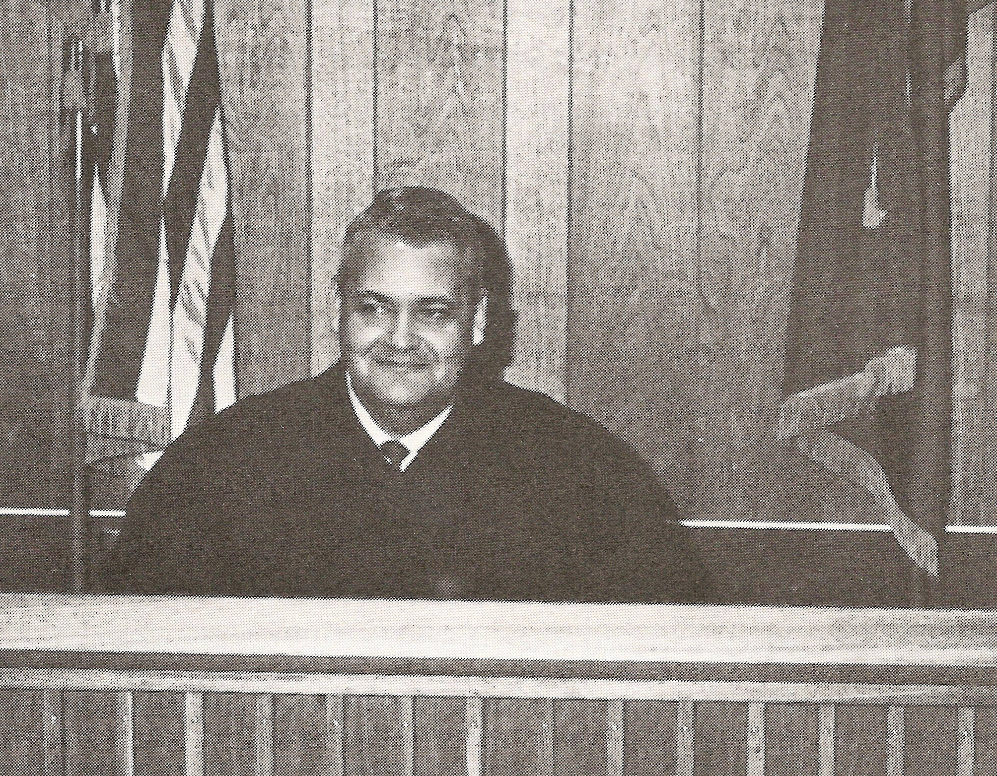 Photo from “Once Upon the Kenai” 
Kenai magistrate Jess Nicholas poses at his bench in this circa 1970 image.