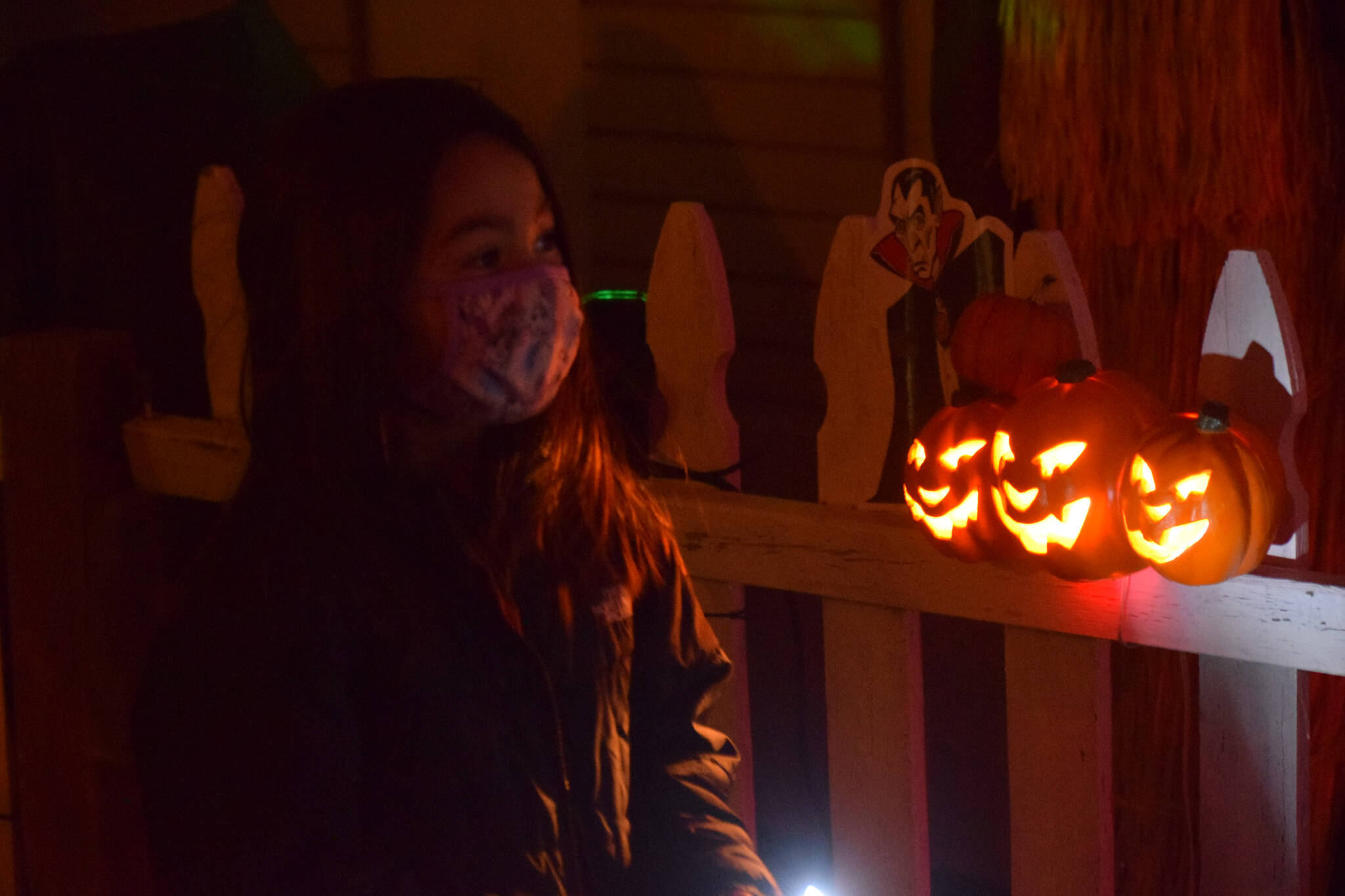 Heather Phillips walks through the Kenai Community Library Haunted Hunt on Tuesday, Oct. 26, 2021. (Camille Botello/Peninsula Clarion)