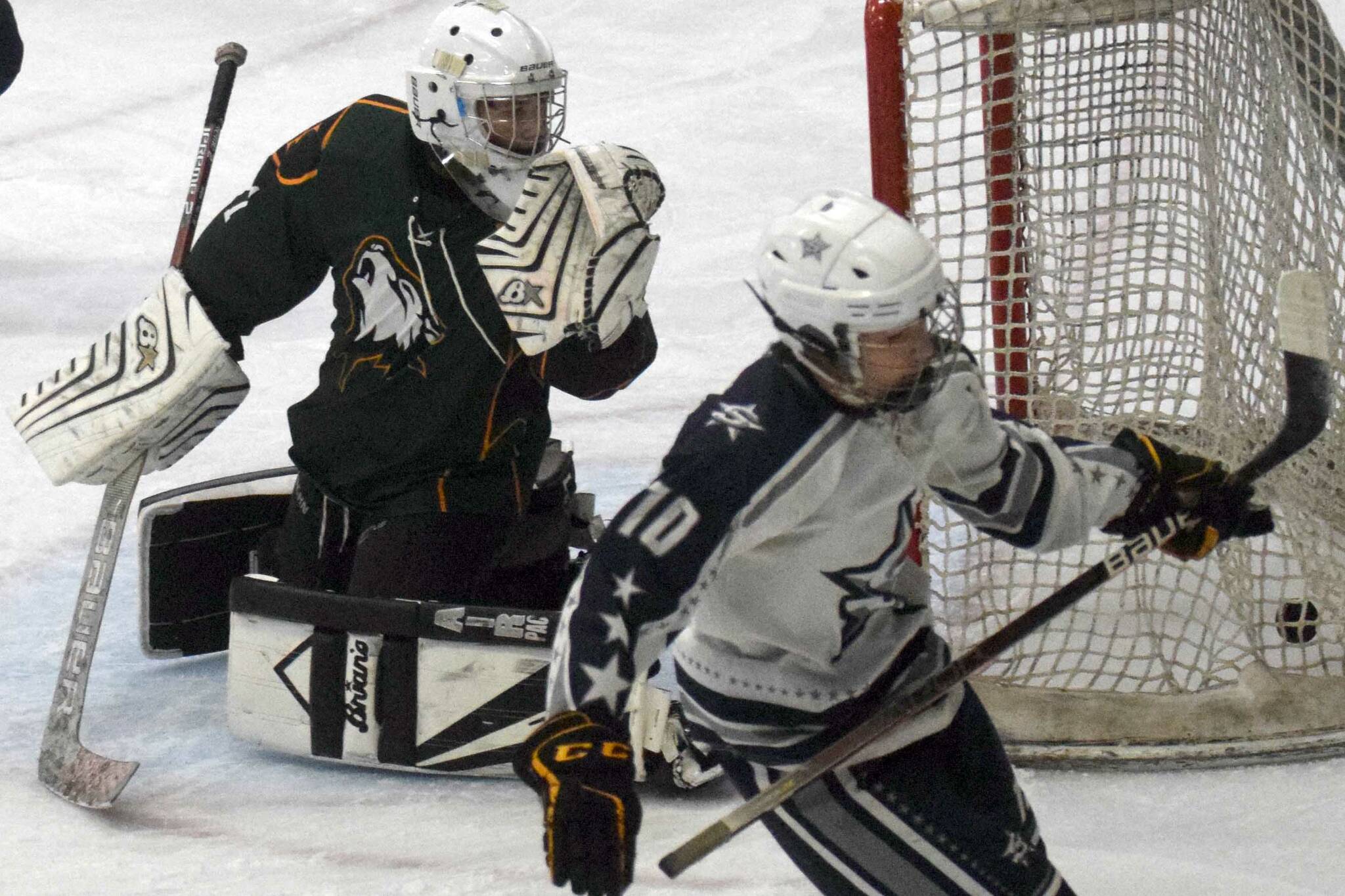 Soldotna's Daniel Heath scores on Delta Junction's Jordan Bouziden on Thursday, Oct. 28, 2021, at the Soldotna Regional Sports Complex in Soldotna, Alaska. (Photo by Jeff Helminiak/Peninsula Clarion)