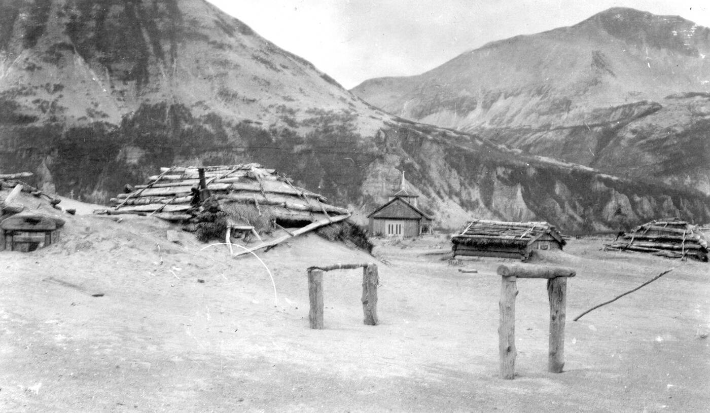 This June 1912, file photo provided by the U.S. Geological Survey shows ash drifts around Katmai village’s then-new Russian Orthodox church after the eruption of Novarupta Volcano in Katmai National Park and Preserve in Alaska. An unusual alert was issued by volcano scientists Wednesday, Nov. 17, 2021, warning that an ash cloud was headed toward Alaska’s Kodiak Island. The ash is from the powerful 1912 eruption of Novarupta, a volcano on the Alaska Peninsula that dropped volcanic ash that is still visible today. (G.C. Martin/U.S. Geological Survey via AP, File)