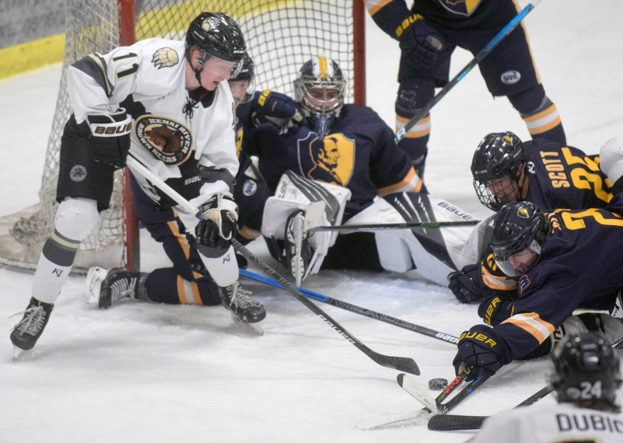 Kenai River Brown Bears forward Bryce Monrean tries to find a way through the defense of the Springfield (Illinois) Jr. Blues during a first-period power play Friday, Nov. 19, 2021, at the Soldotna Regional Sports Complex. (Photo by Jeff Helminiak/Peninsula Clarion)