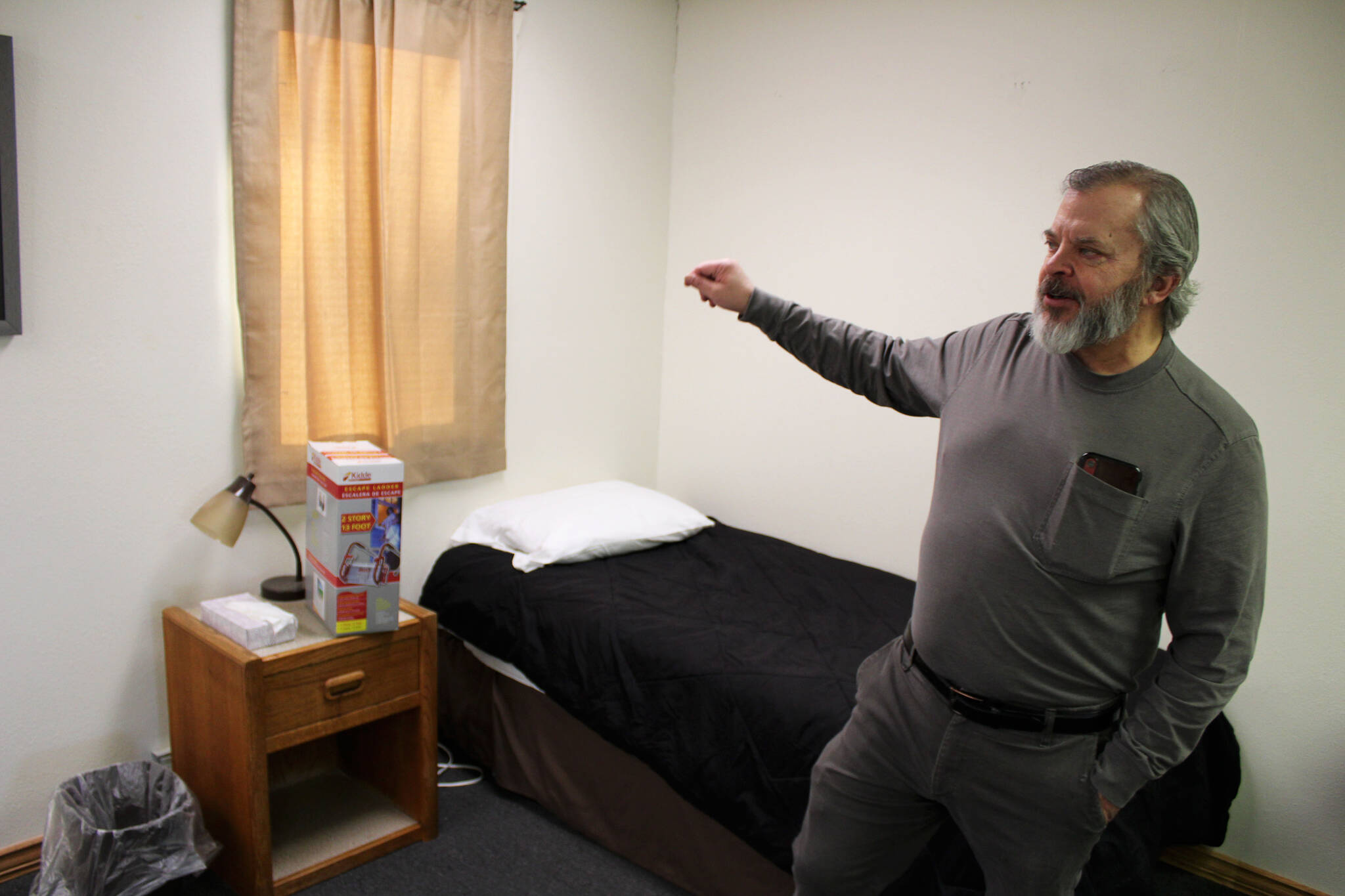 Tim Navarre stands in a bedroom at a cold weather shelter set to open next month on Monday, Nov. 22, 2021 in Nikiski, Alaska. (Ashlyn O'Hara/Peninsula Clarion)