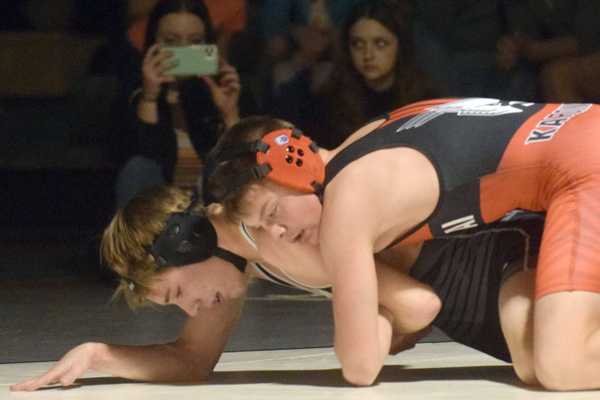 Kenai Central’s Sawyer Vann controls Nikiski’s Wyatt Maguire at 125 pounds Tuesday, Nov. 23, 2021, at Nikiski High School in Nikiski, Alaska. Vann notched a 7-6 victory. (Photo by Jeff Helminiak/Peninsula Clarion)