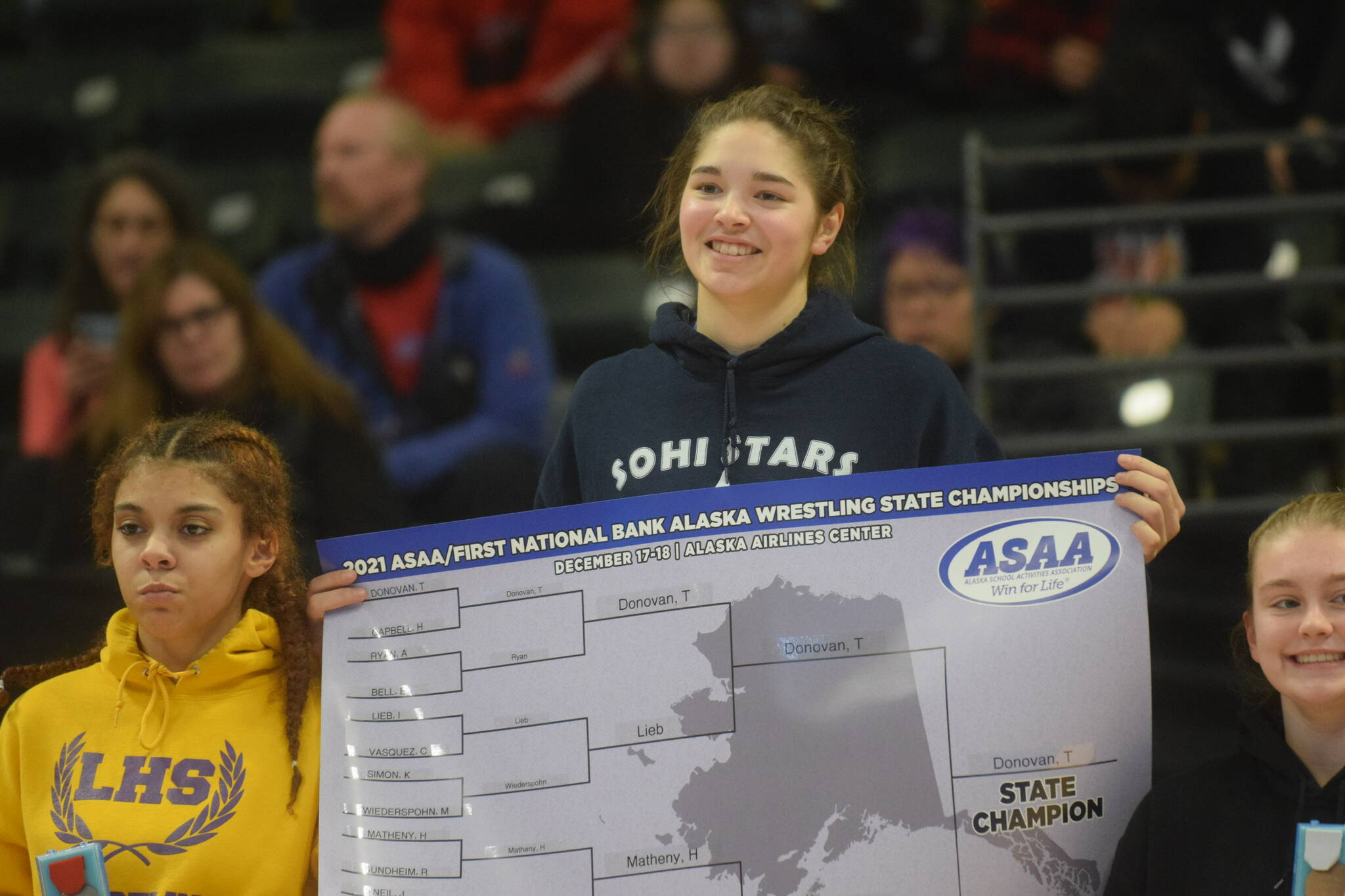 Soldotna High School's Trinity Donovan wins her third straight wrestling title during the state girls tournament at the Alaska Airlines Center in Anchorage on Saturday, Dec. 18, 2021. (Camille Botello/Peninsula Clarion)