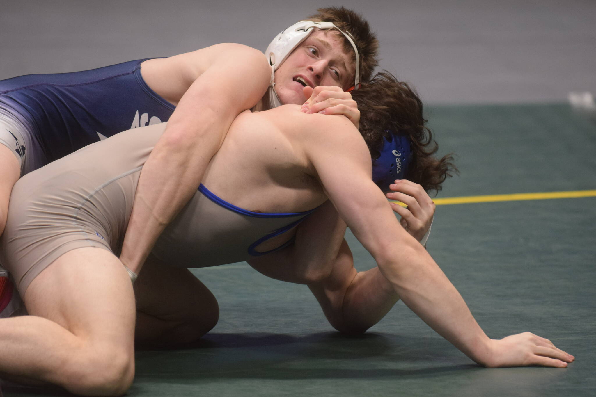 Soldotna High School’s Wayne Mellon wins a DI wrestling title during the state tournament at the Alaska Airlines Center in Anchorage on Saturday, Dec. 18, 2021. (Camille Botello/Peninsula Clarion)