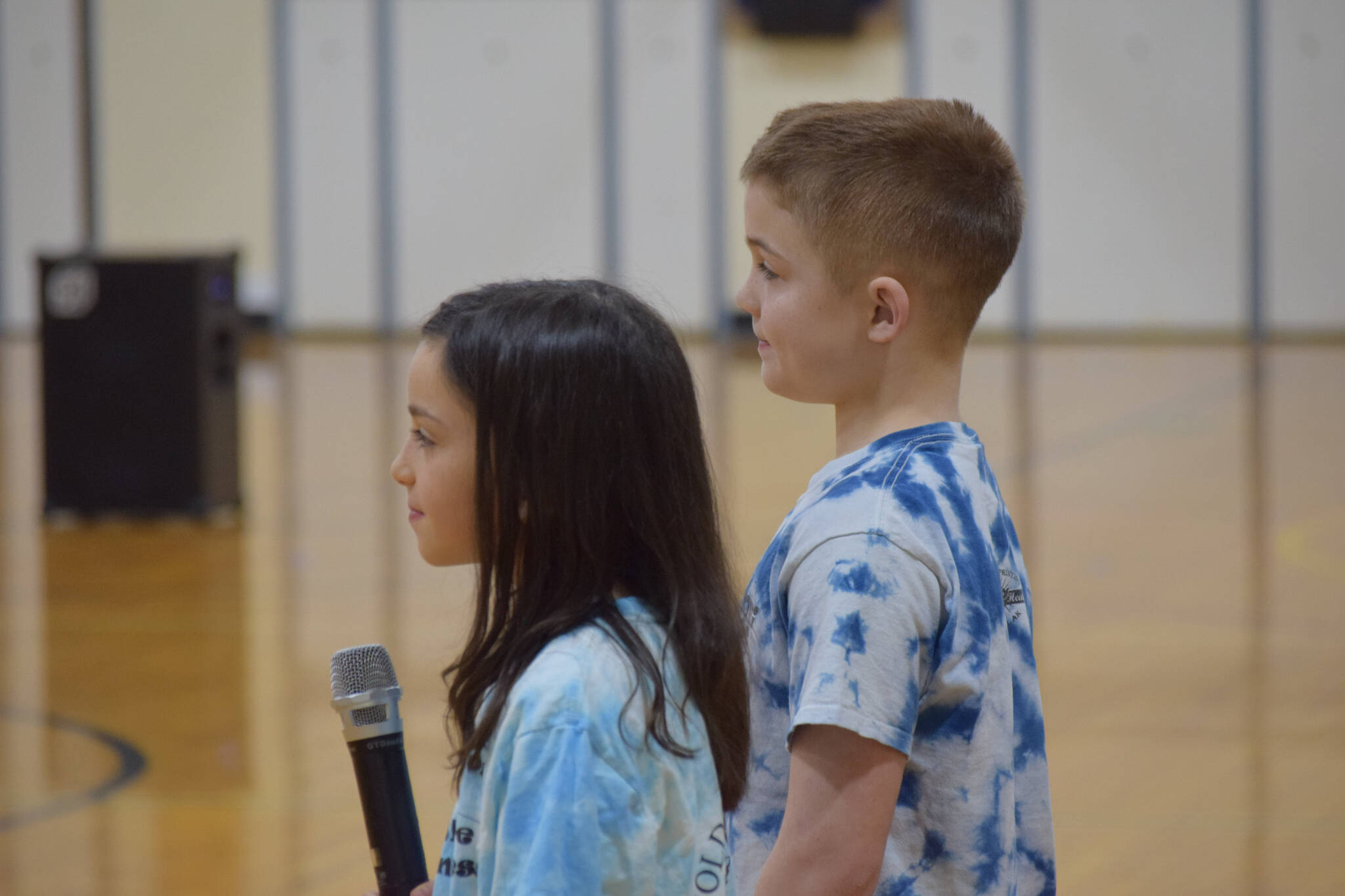 Avi Bloom and Hudson Morris speak about their National Blue Ribbon award during an assembly at Soldotna Montessori Charter School on Friday, Jan 14, 2022. (Camille Botello / Peninsula Clarion)