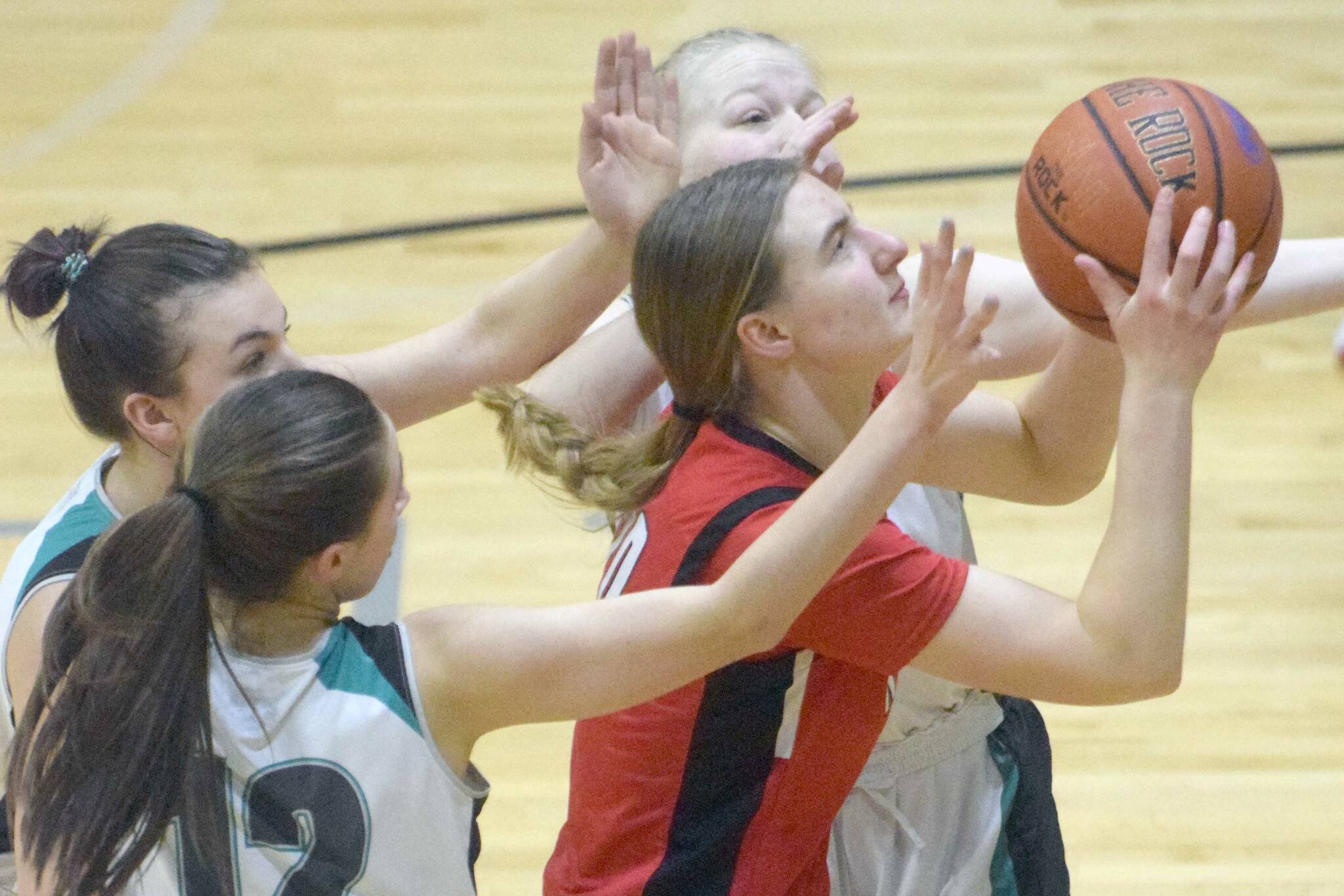 Kenai Central's Erin Koziczkowski goes up for a shot against Nikiski on Friday, Jan. 14, 2022, at Nikiski High School in Nikiski, Alaska. (Photo by Jeff Helminiak/Peninsula Clarion)