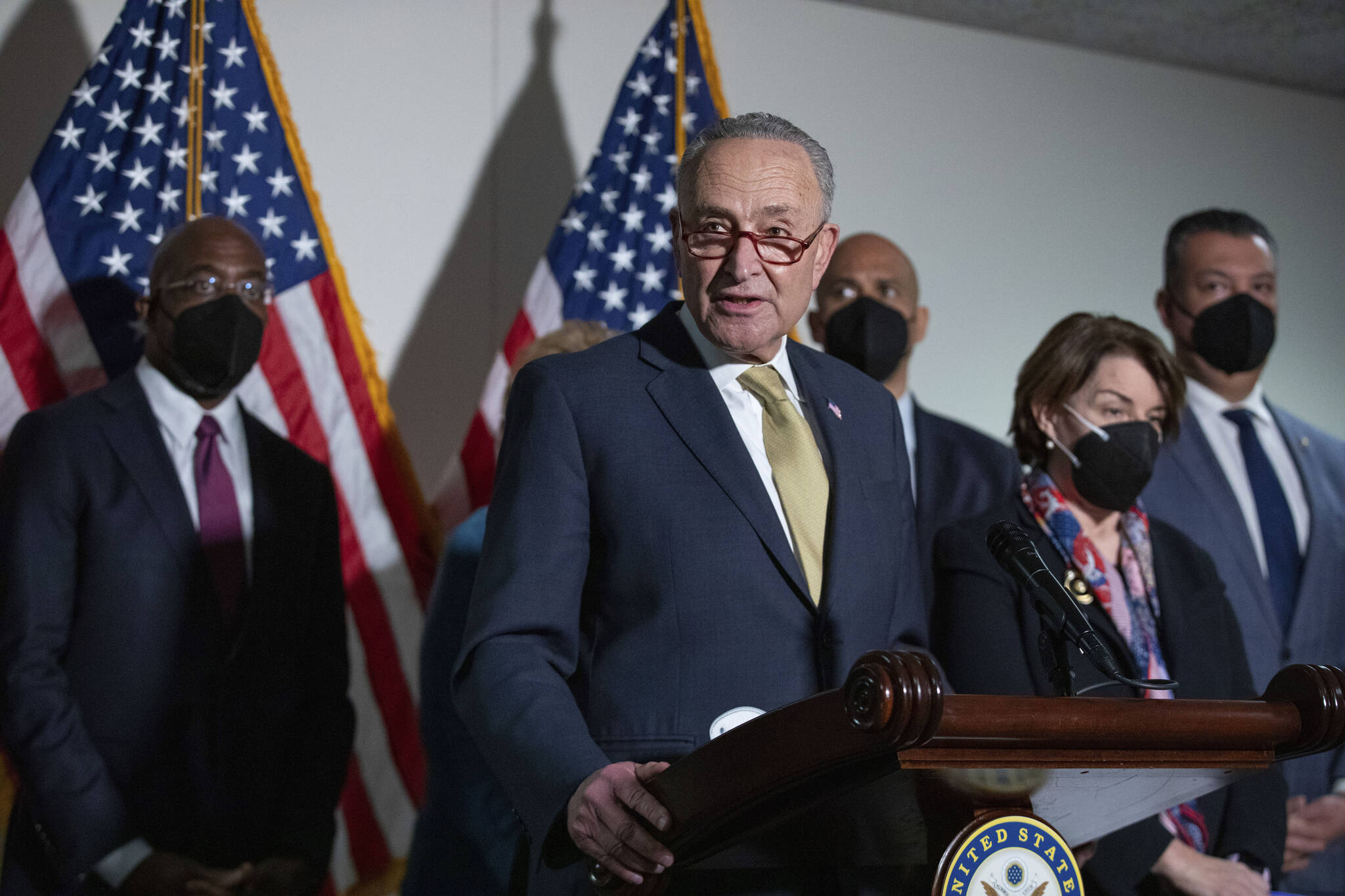 Senate Majority Leader Chuck Schumer, D-N.Y., speaks to reporters alongside, from left, Sen. Raphael Warnock, D-Ga., Sen. Cory Booker, D-N.J., Sen. Amy Klobuchar, D-Minn., and Sen. Alex Padilla, D-Calif., during a press conference regarding the Democratic party’s shift to focus on voting rights at the Capitol in Washington, Tuesday, Jan. 18, 2022. (AP Photo/Amanda Andrade-Rhoades)