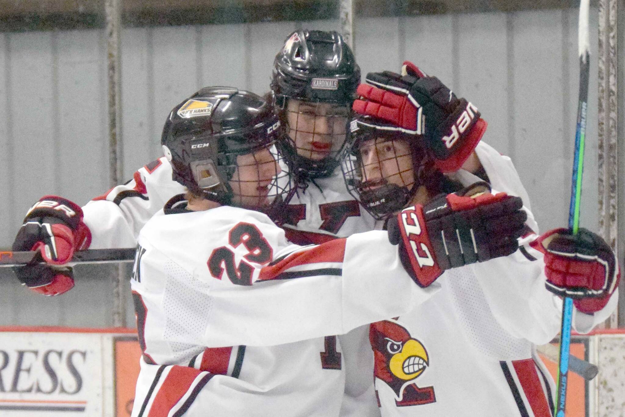 Kenai's Caden Warren, Landon Cialek and Logan Mese celebrate a goal by Mese against Palmer on Friday, Jan. 21, 2022, at the Kenai Multi-Purpose Facility in Kenai, Alaska. (Photo by Jeff Helminiak/Peninsula Clarion)