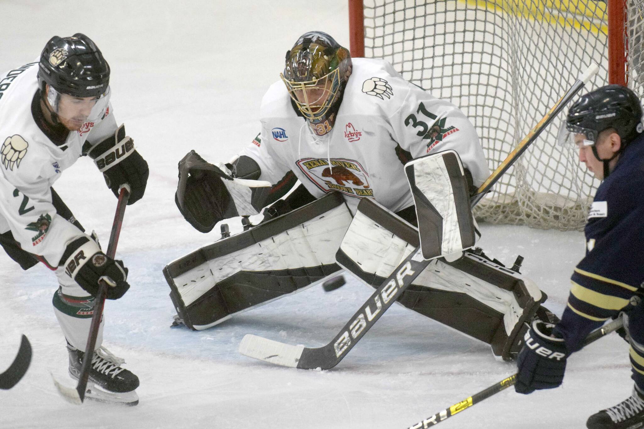 Kenai River Brown Bears goalie Tommy Aitken makes a save against the Janesville (Wisconsin) Jets on Sunday, Jan. 23, 2022, at the Soldotna Regional Sports Complex in Soldotna, Alaska. (Photo by Jeff Helminiak/Peninsula Clarion)