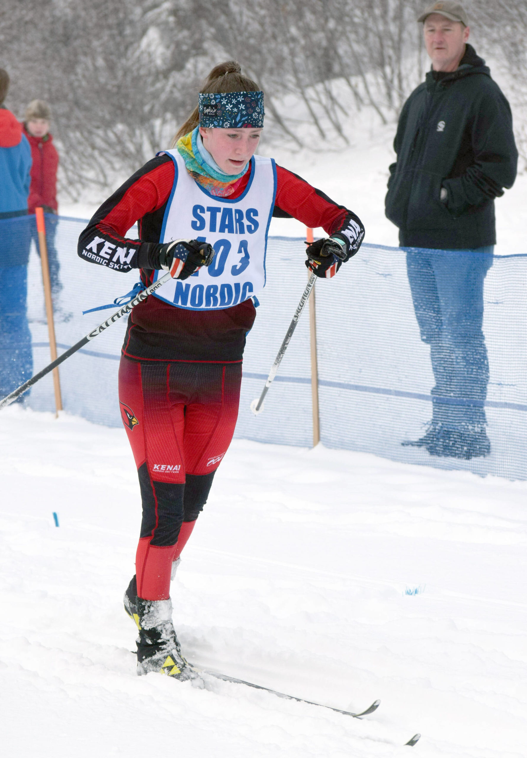 Kenai’s Jayna Boonstra finishes the girls 5-kilometer mass start classic race Saturday, Feb. 12, 2022, at the Region III ski championships at Tsalteshi Trails just outside of Soldotna, Alaska. (Photo by Camille Botello/Peninsula Clarion)