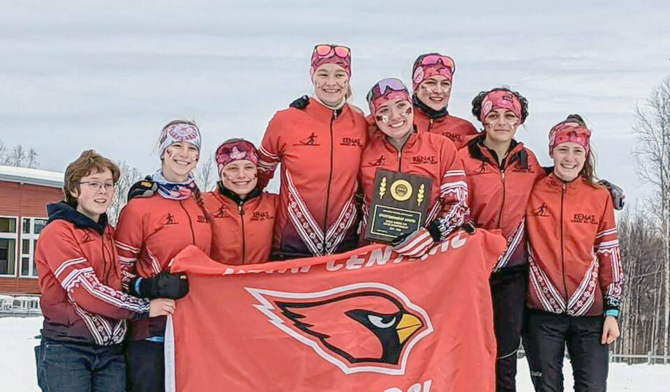 Kenai Central’s Audrey Larson, Betsy Moffett, Madison McDonald, Emily Moss, Gabriella Tews, Leah Fallon, Summer Foster and Jayna Boonstra celebrate a Division II championship, academic award and sportsmanship award Saturday, Feb. 26, at the state ski meet in Fairbanks, Alaska. (Photo provided)