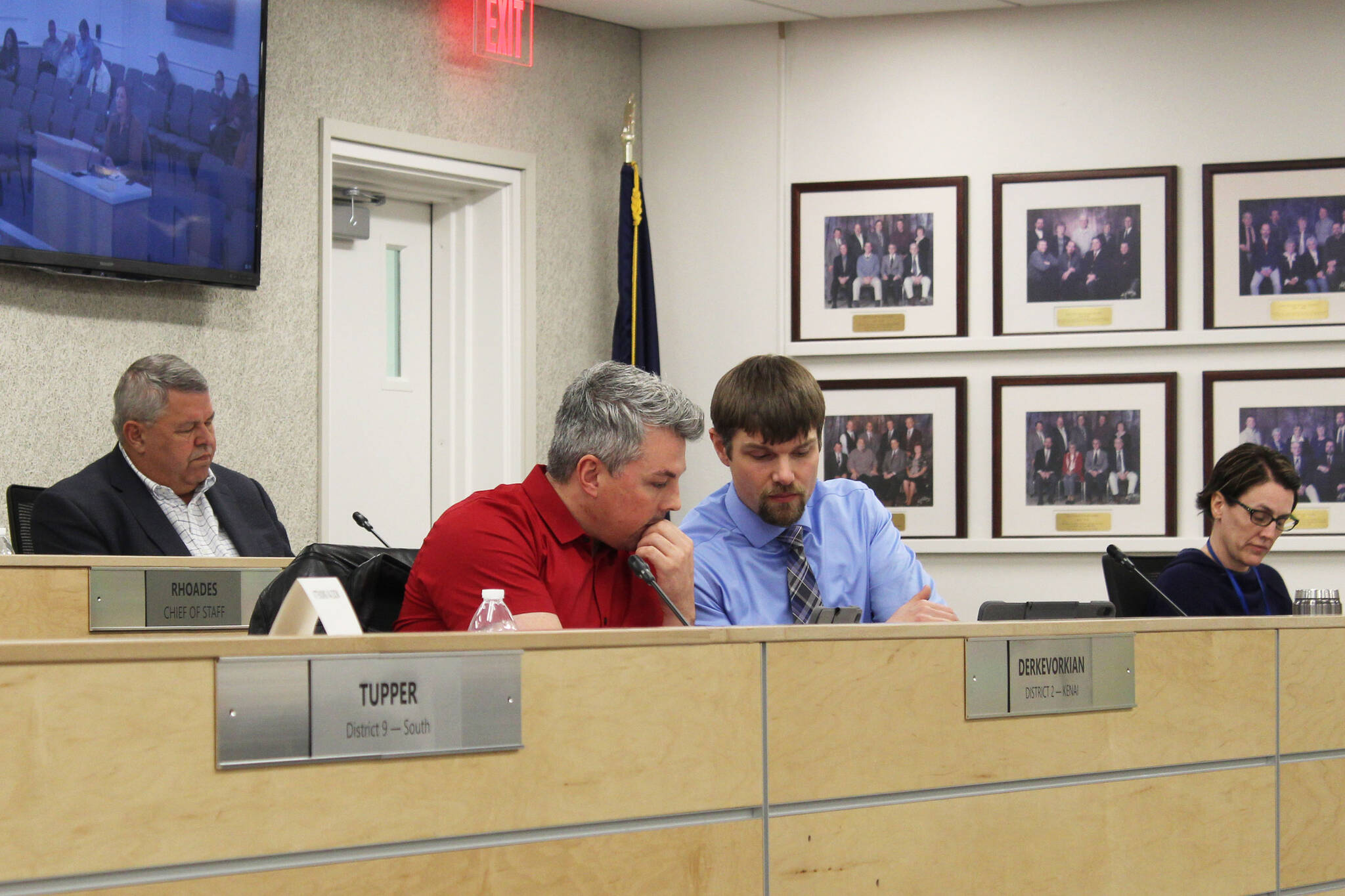 Assembly members Richard Derkevorkian (left) and Jesse Bjorkman consult during a meeting of the Kenai Peninsula Borough Assembly on Tuesday, Dec. 7, 2021 in Soldotna, Alaska. (Ashlyn O’Hara)
