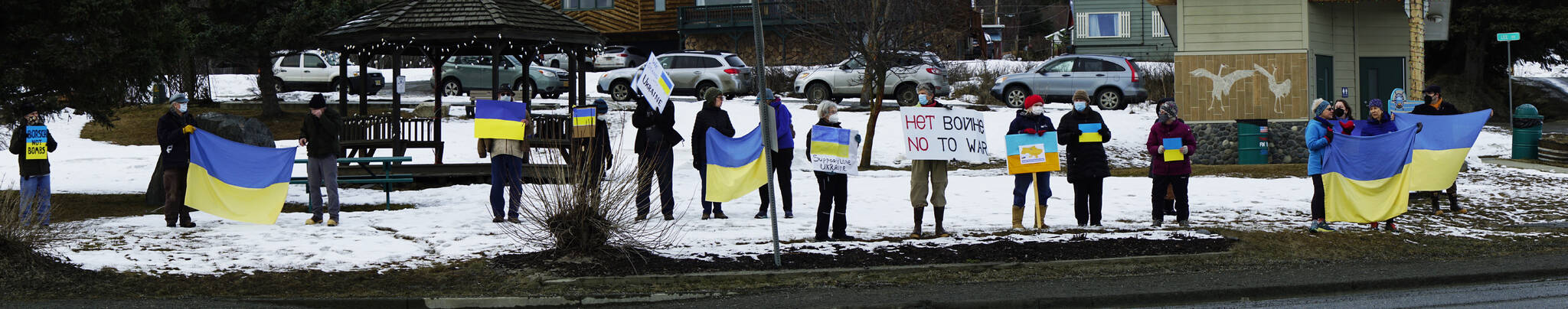 People participate in a demonstration on Thursday, March 3, 2022, at WKFL Park in Homer, Alaska, in support of Ukraine and against the Russian invasion. (Photo by Michael Armstrong/Homer News)