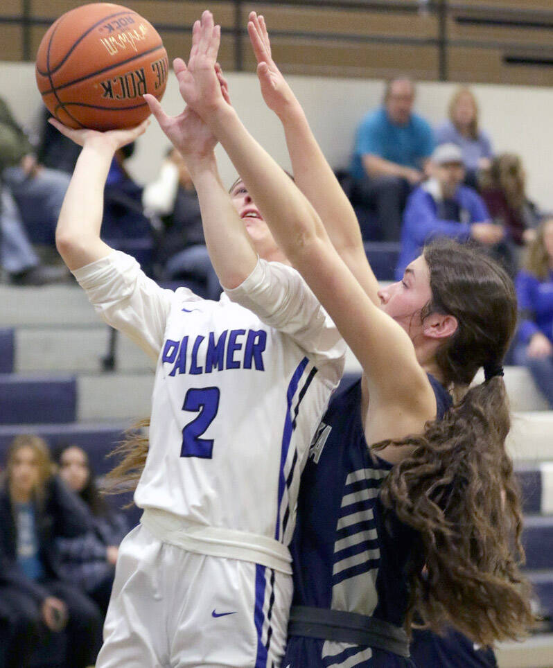 Soldotna’s Ellie Burns reaches for a block on Palmer’s Paige Marshall during a loss to Palmer in the first round of the Northern Lights Conference tournament Thursday, March 17, 2022, at Palmer High School in Palmer, Alaska. (Photo by Ron Jones/matsusports.net)