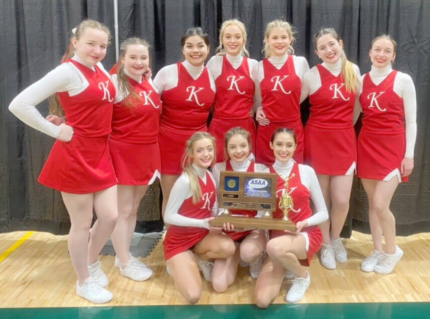 The Kenai Central cheerleading team poses with their trophy for winning the Division II March Madness state competition at the Alaska Airlines Center in Anchorage, Alaska, on Tuesday, March 22, 2022. In the back row are Kaitlyn Taylor, Delaney Duck, Genesis Trevino, Calani Holmes, Malena Grieme, Maya Montague and Karah Huff. In the front row are Brooklynn Reed, Ella Romero and Annemarie Pienta. (Photo provided by team)