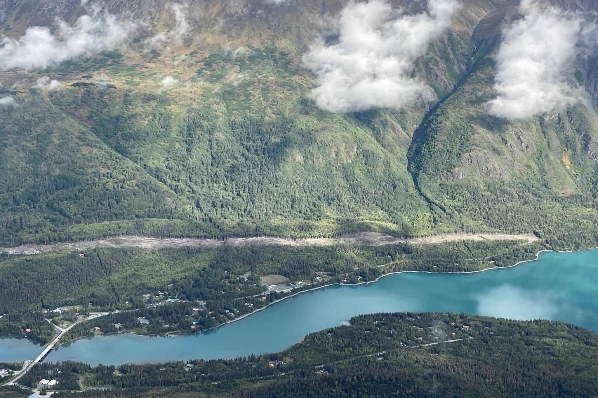 An area cleared to make way for the Cooper Landing Bypass project can be seen above the intersection of the Kenai River and Kenai Lake in Cooper Landing, Alaska, on Sept. 6, 2021. (Photo by Jeff Helminiak/Peninsula Clarion)