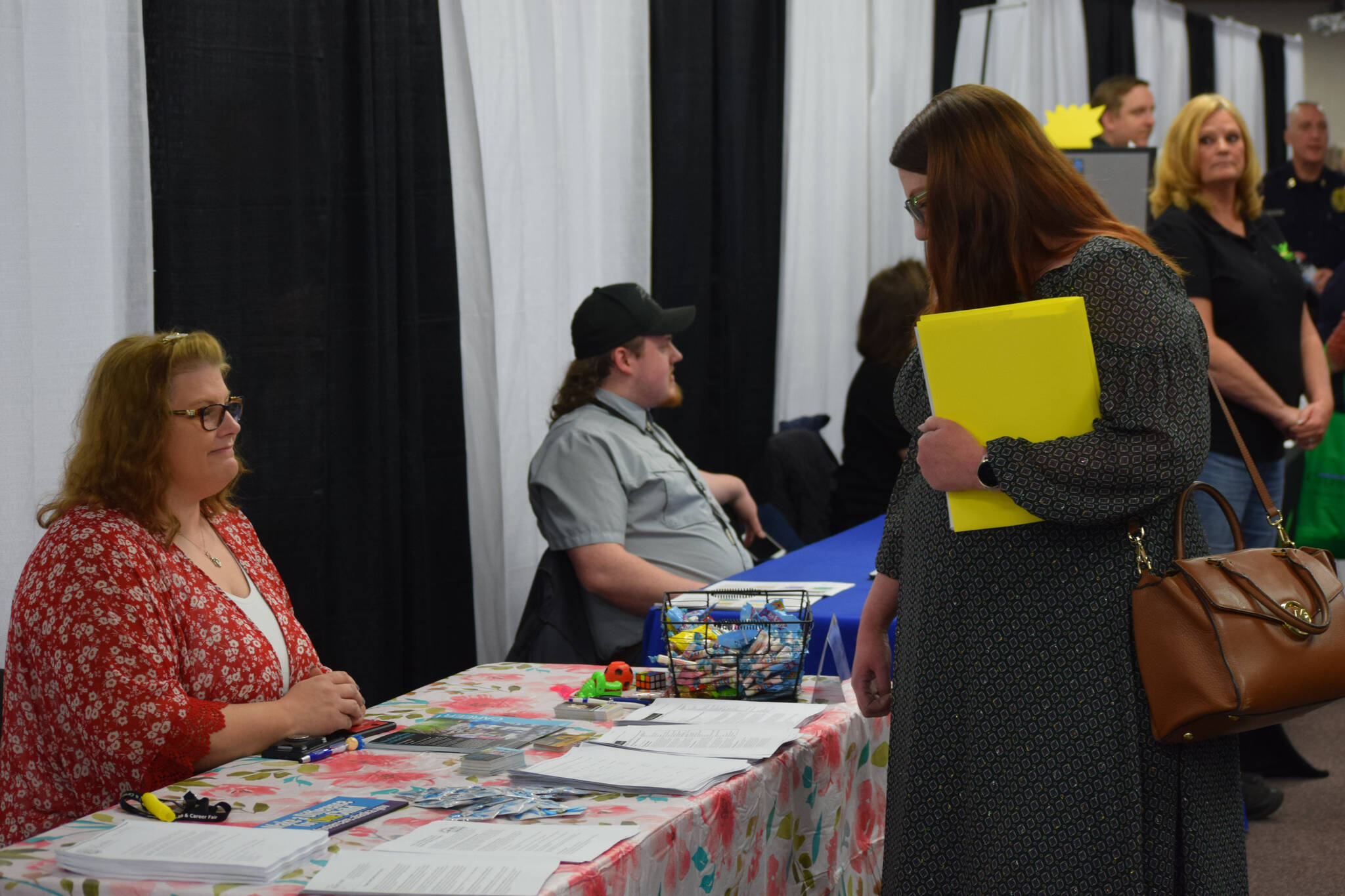 Community members participate in the Kenai Peninsula Job and Career Fair at the Soldotna Regional Sports Complex on Thursday, April 7, 2022, in Soldotna, Alaska. (Camille Botello/Peninsula Clarion)