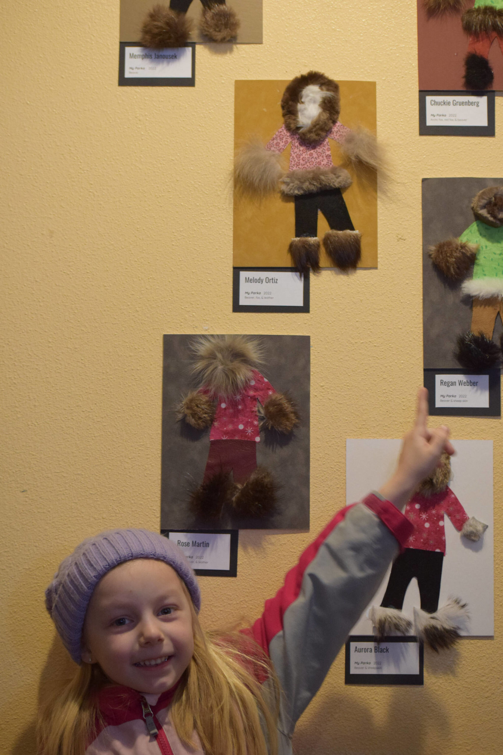 Soldotna Elementary School kindergartner Melody Ortiz, 6, shows off her art at Kaladi Brothers Coffee on South Kobuk Street in Soldotna, Alaska, on Friday, April 8, 2022. (Camille Botello/Peninsula Clarion)