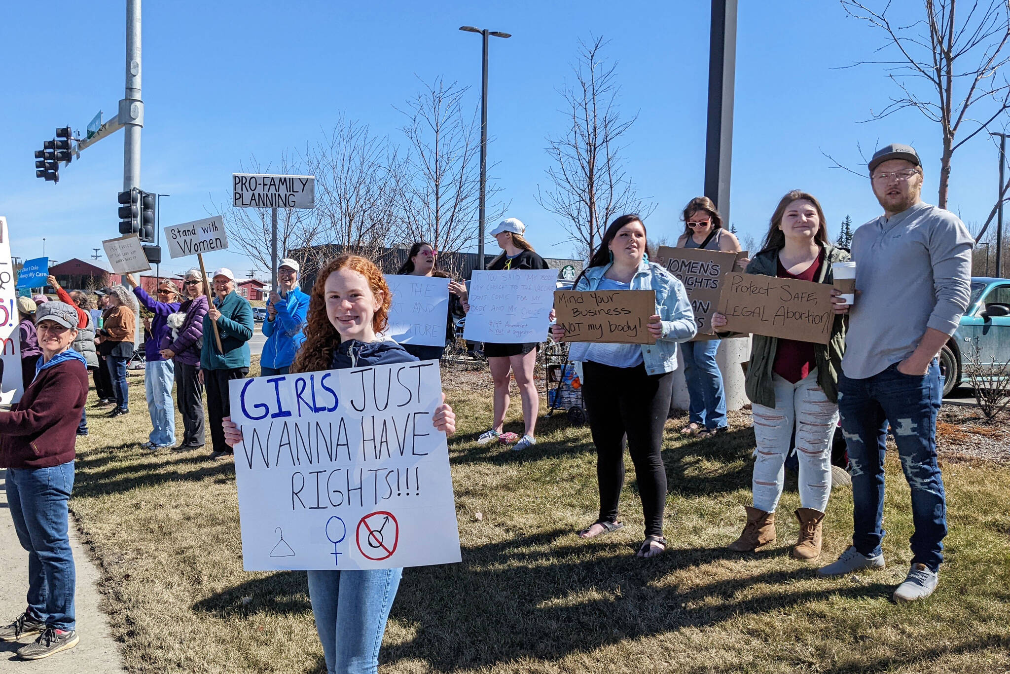 Demonstrators in support of abortion rights stand at the intersection of the Kenai and Sterling highways on Saturday, May 7, 2022, in Soldotna, Alaska. (Photo by Erin Thompson/Peninsula Clarion)