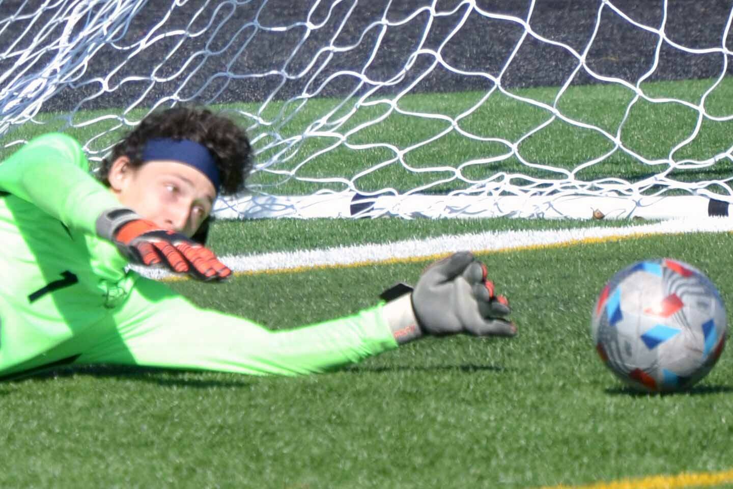 Homer goalie Lucas Story makes a save Tuesday, May 10, 2022, at Ed Hollier Field at Kenai Central High School in Kenai, Alaska. (Photo by Jeff Helminiak/Peninsula Clarion)