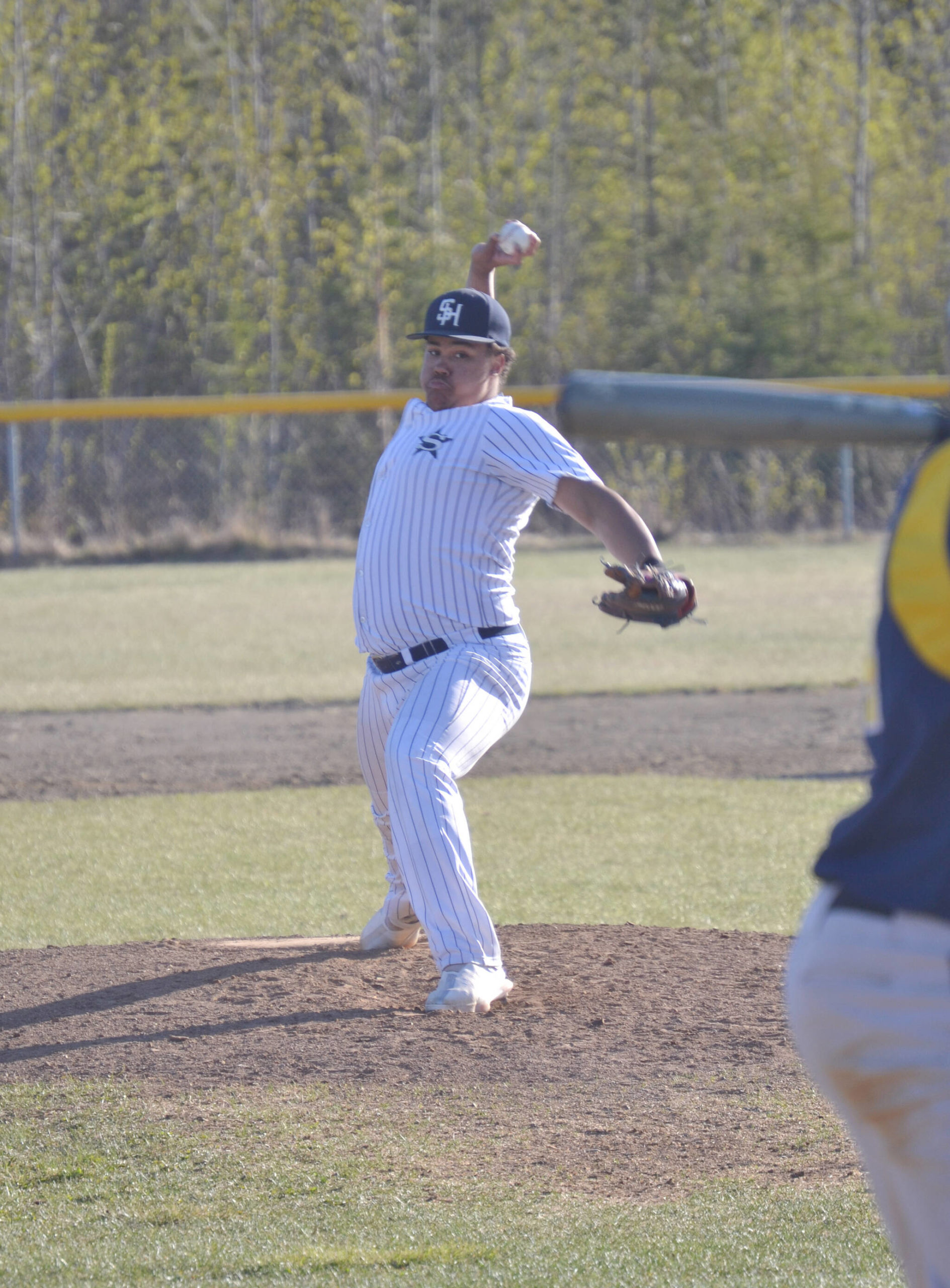 Soldotna’s Atticus Gibson delivers to Homer on Tuesday, May 17, 2022, at the Soldotna Little League fields in Soldotna, Alaska. (Photo by Jeff Helminiak/Peninsula Clarion)