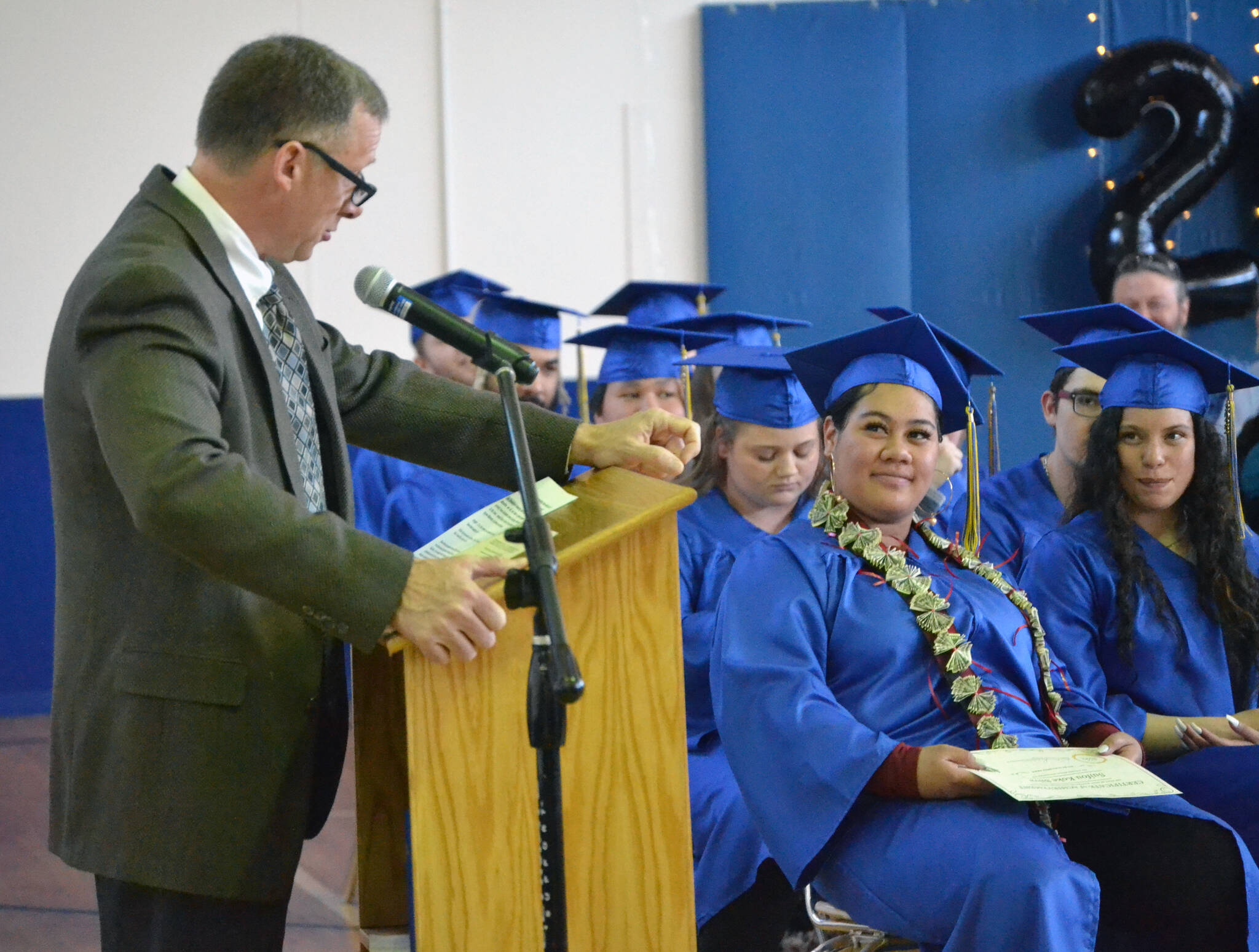 Loren Reese, principal at Kenai Alternative High School, addresses the audience at graduation ceremonies Wednesday, May 18, 2022, at Kenai Alternative High School in Kenai, Alaska. (Photo by Jeff Helminiak/Peninsula Clarion)