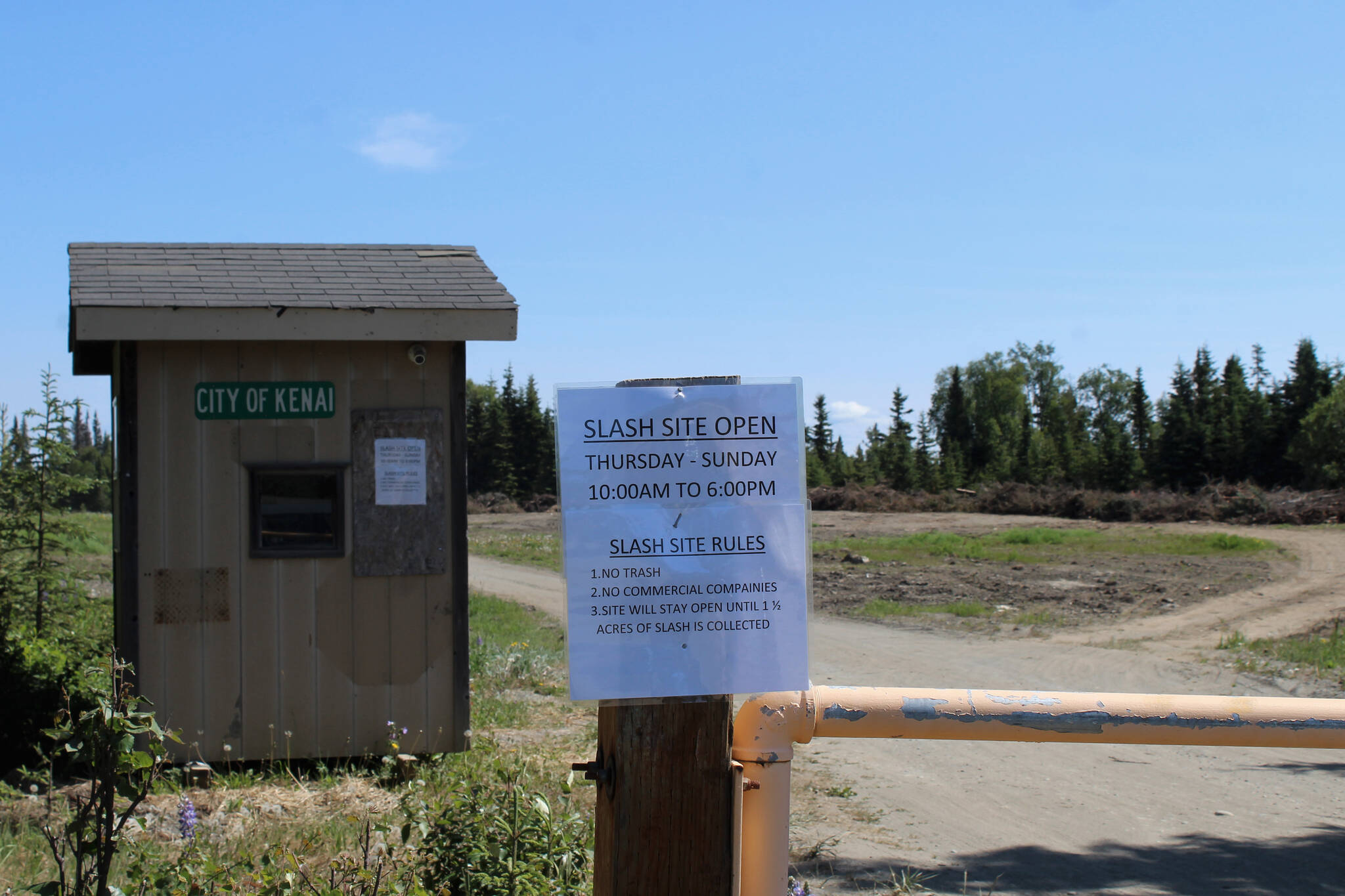 Signage marks the entrance of the City of Kenai’s slash disposal site on Wednesday, June 15, 2022, in Kenai, Alaska. (Ashlyn O’Hara/Peninsula Clarion)