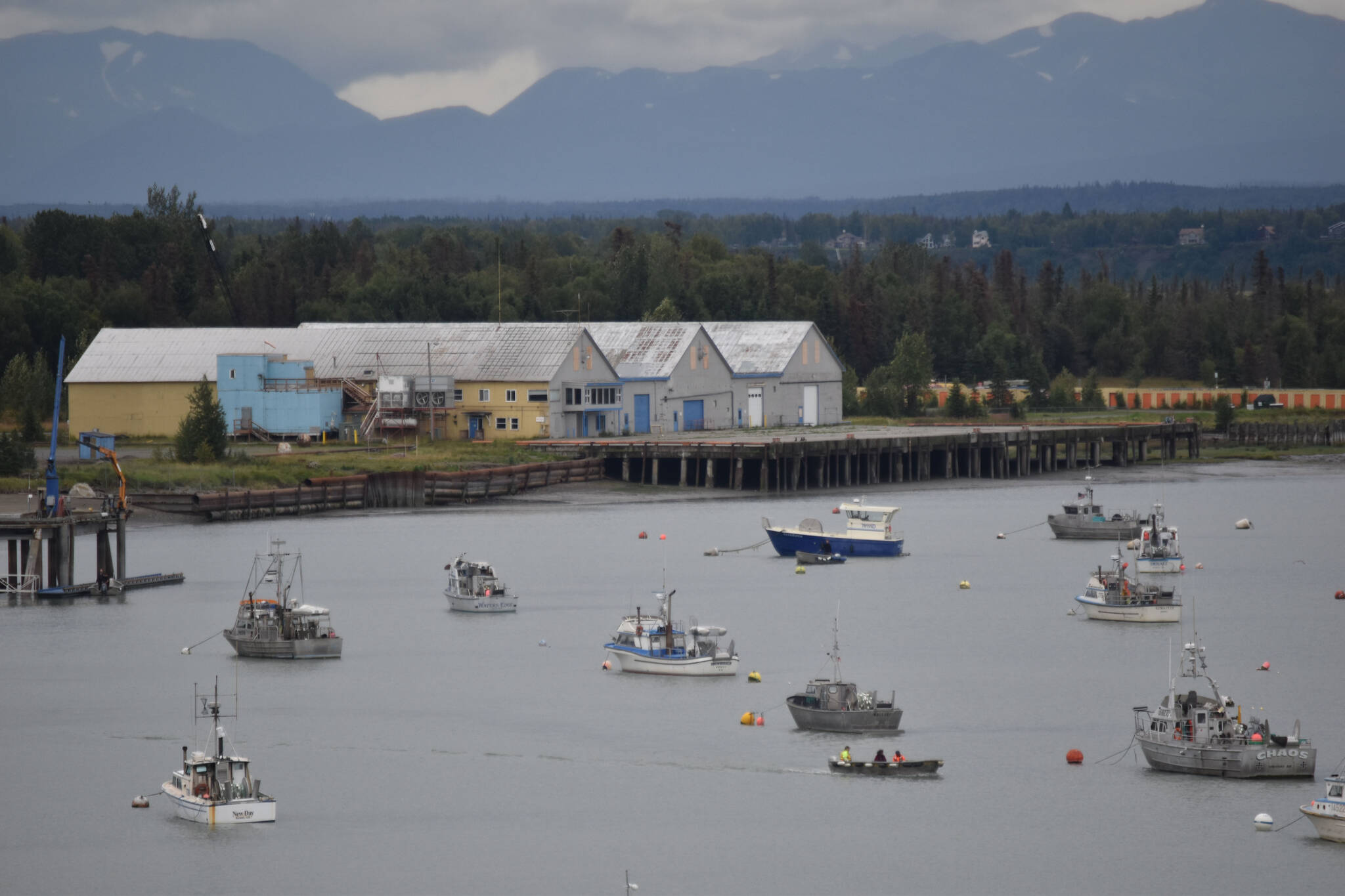 Boats sit near the mouth of the Kenai River on Aug. 22, 2022, in Kenai, Alaska. (Jake Dye/Peninsula Clarion)