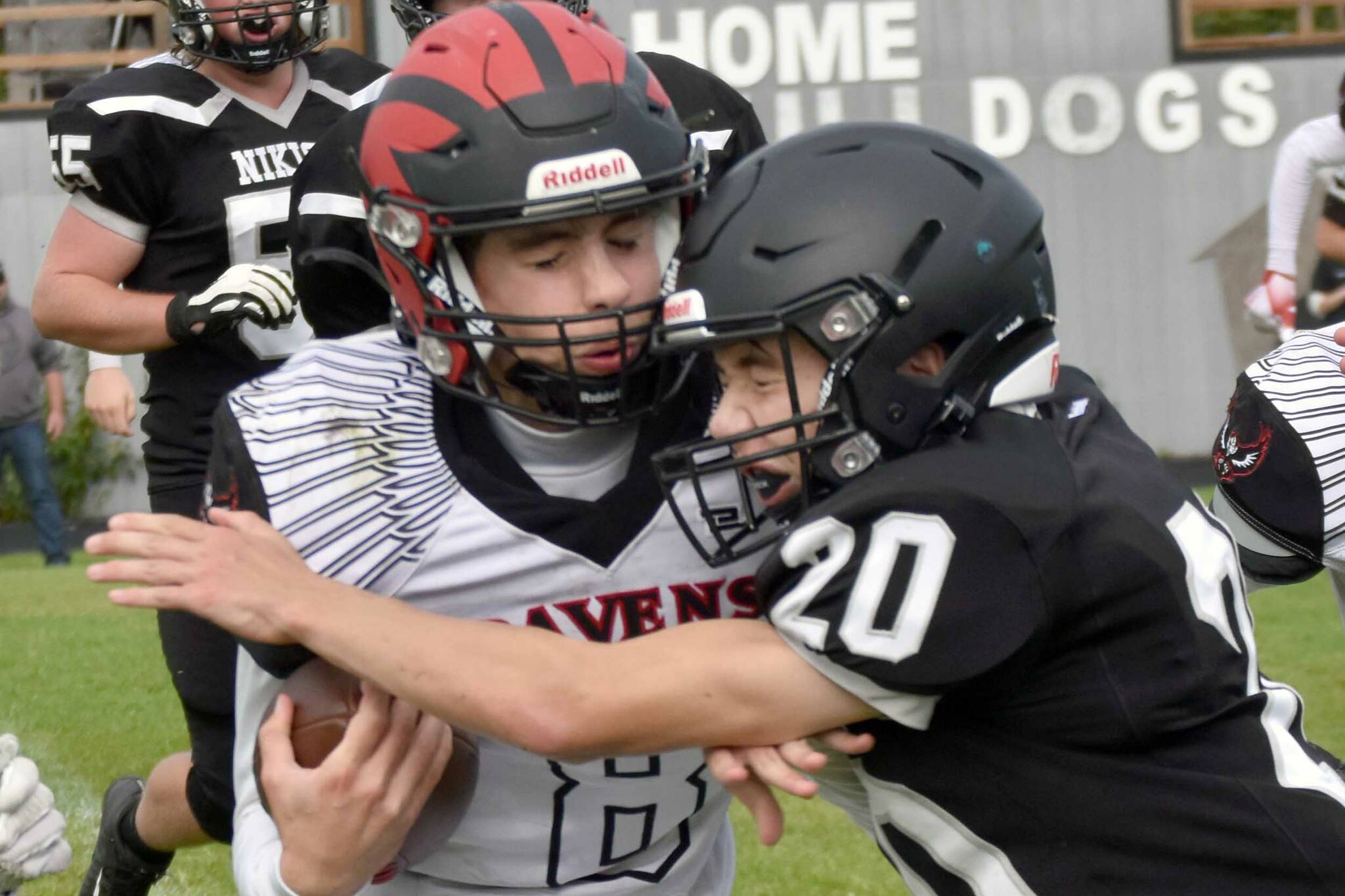 Eielson's Evan Brown is tackled by Nikiski's Wyatt Maguire on Saturday, Aug. 27, 2022, at Nikiski High School in Nikiski, Alaska. (Photo by Jeff Helminiak/Peninsula Clarion)