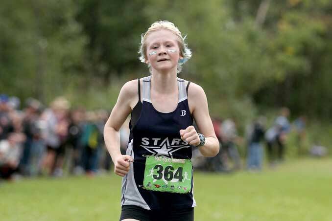 Soldotna freshman Sophia Jedlicki sprints to a first-place finish in the varsity girls race during the Colony Invitational on Saturday, Aug. 27, 2022, at Colony High School in Palmer, Alaska. (Photo by Bruce Eggleston/matsusports.net)