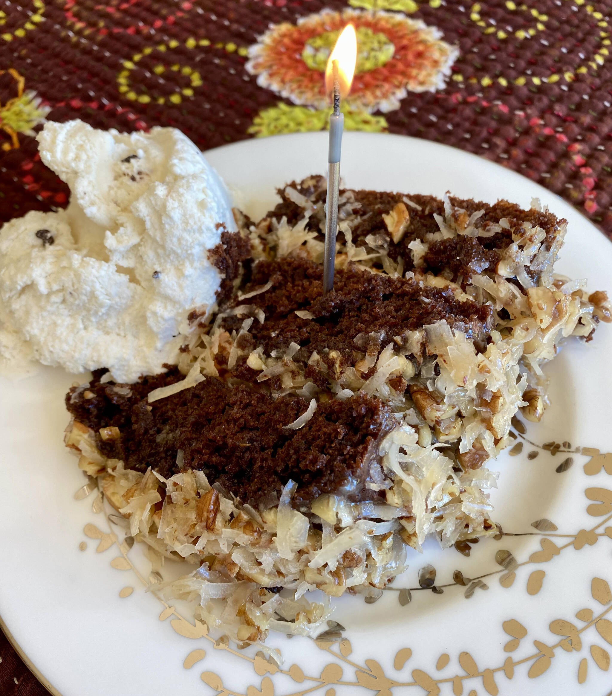 This German chocolate cake is rich and decadent and looks beautiful with a sparkling candle on top. (Photo by Tressa Dale/Peninsula Clarion)