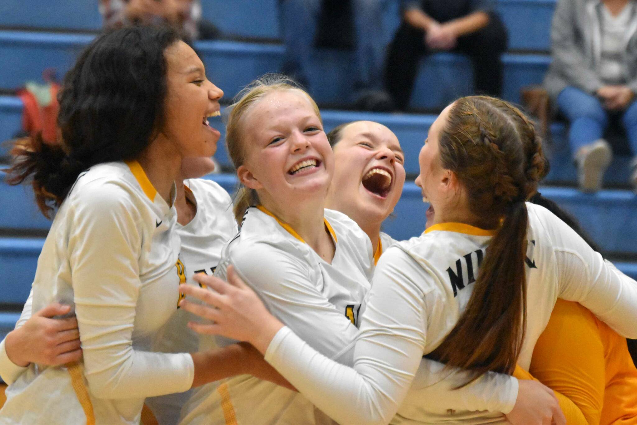 The Nikiski volleyball team celebrates after defeating Soldotna on Thursday, Sept. 8, 2022, at Soldotna High School in Soldotna, Alaska. (Photo by Jake Dye/Peninsula Clarion)