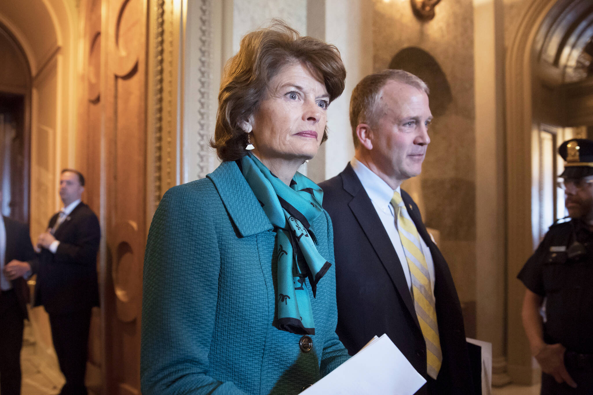 Sen. Lisa Murkowski, R-Alaska, left, and Sen. Dan Sullivan, R-Alaska, leave the chamber after a vote on Capitol Hill in Washington on May 10, 2017. Two Russians who said they fled the country to avoid compulsory military service have requested asylum in the U.S. after landing on a remote Alaskan island in the Bering Sea, Alaska U.S. Sen. Lisa Murkowski’s office said Thursday, Oct. 6, 2022. (AP Photo/J. Scott Applewhite, File)